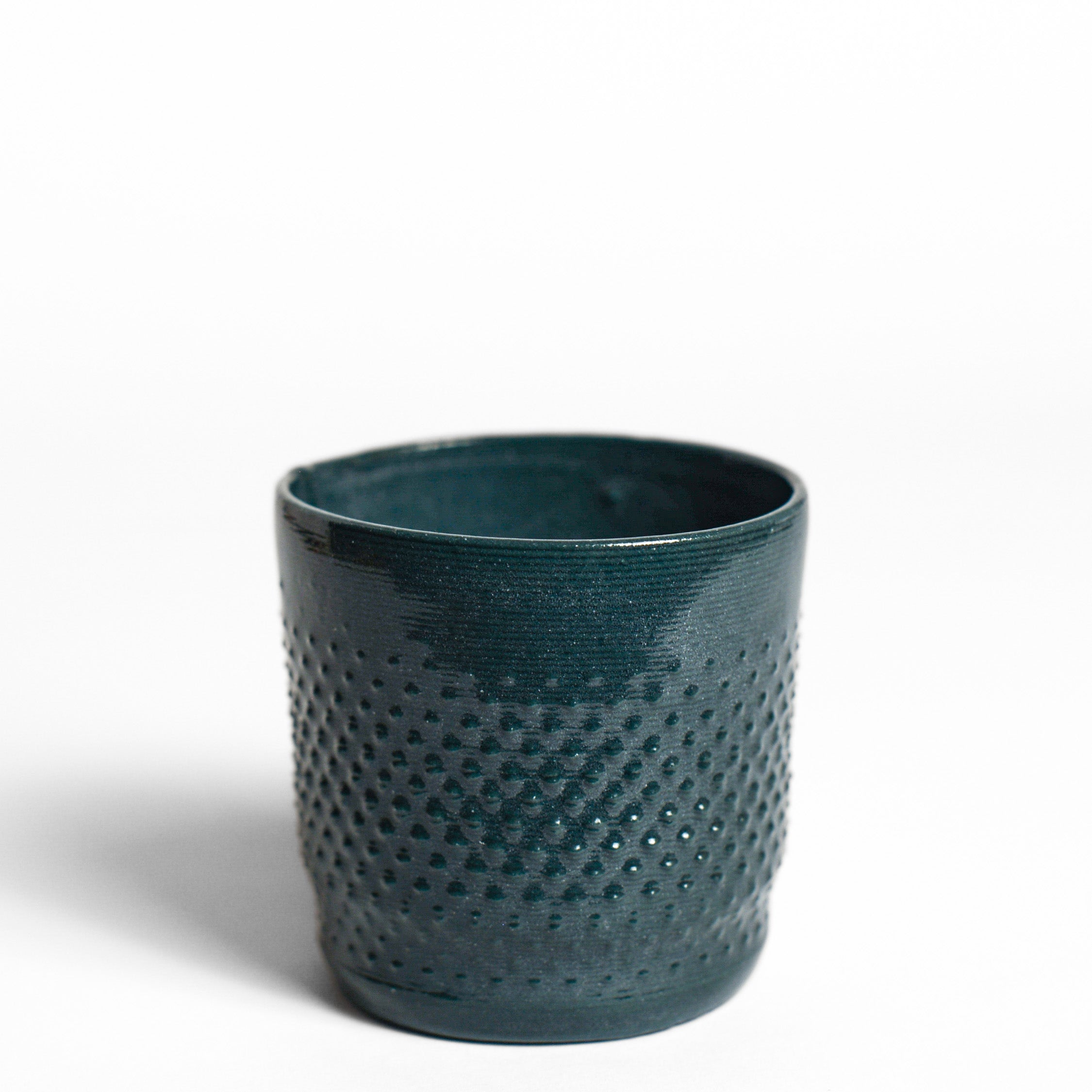 Porcelain cup made by Alterfact using 3D printing techniques in clay. Alterfact is an Australian duo composed of ceramicist Lucile Sciallano and designer Ben Landau based in Melbourne where they create contemporary ceramics using 3D printing techniques.