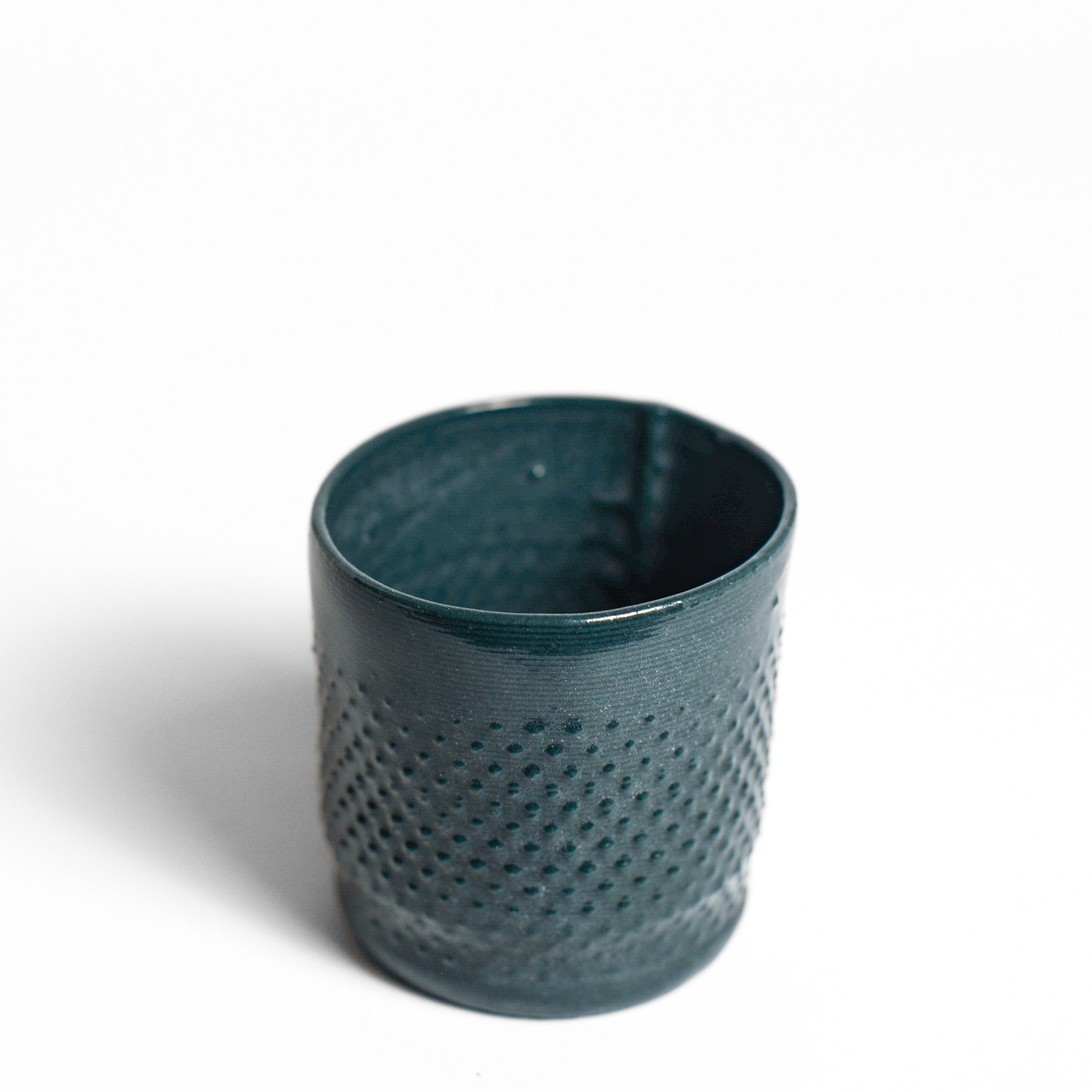 Porcelain cup made by Alterfact using 3D printing techniques in clay. Alterfact is an Australian duo composed of ceramicist Lucile Sciallano and designer Ben Landau based in Melbourne where they create contemporary ceramics using 3D printing techniques.
