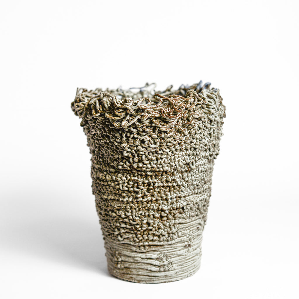 Porcelain cup made by Alterfact using 3D printing techniques in clay. Alterfact is an Australian duo composed of ceramicist Lucile Sciallano and designer Ben Landau based in Melbourne where they create contemporary ceramics using 3D printing techniques. porcelain