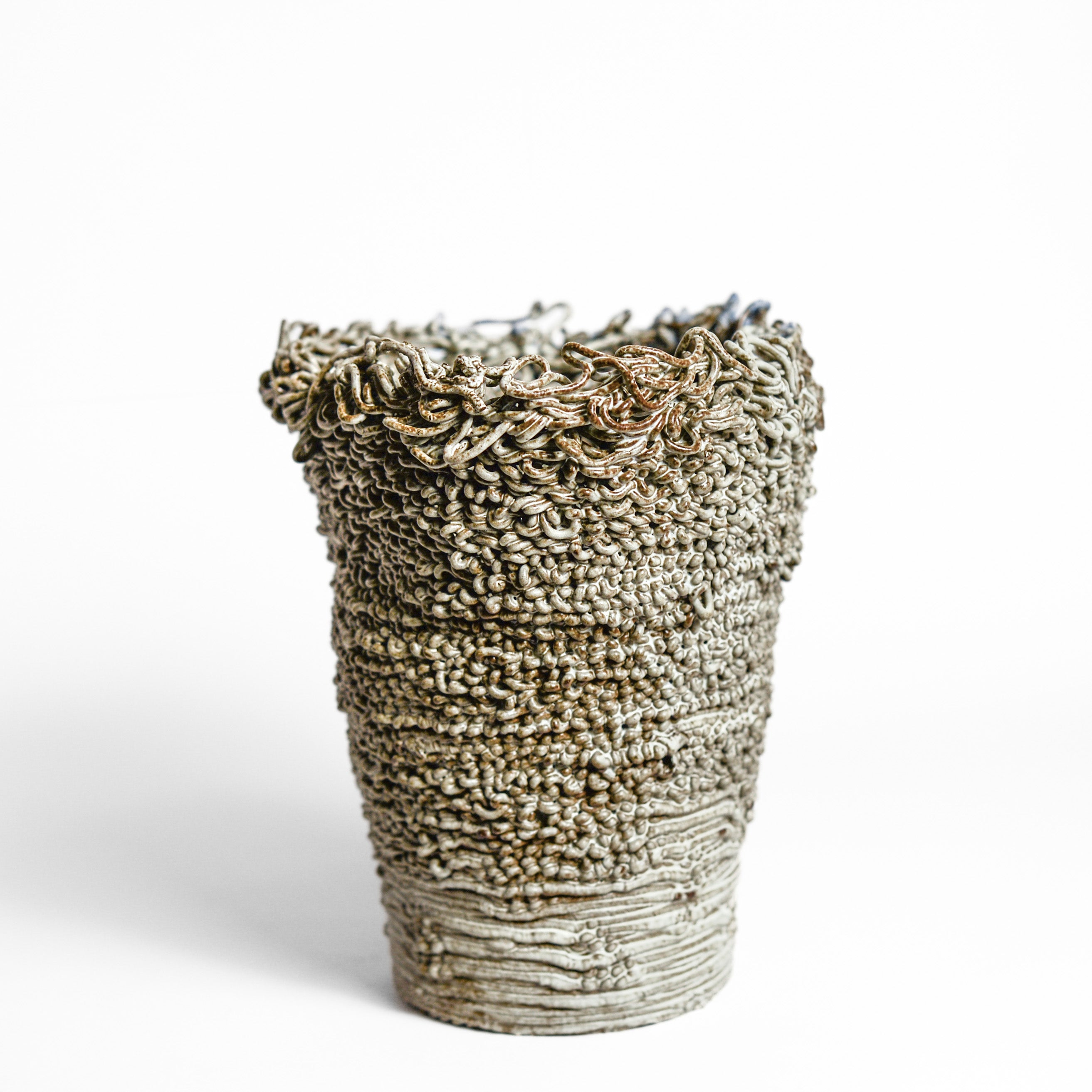 Porcelain cup made by Alterfact using 3D printing techniques in clay. Alterfact is an Australian duo composed of ceramicist Lucile Sciallano and designer Ben Landau based in Melbourne where they create contemporary ceramics using 3D printing techniques. porcelain