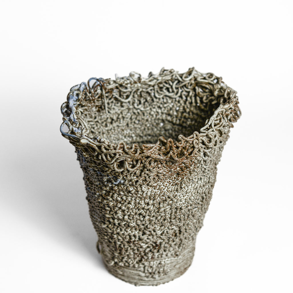 Porcelain cup made by Alterfact using 3D printing techniques in clay. Alterfact is an Australian duo composed of ceramicist Lucile Sciallano and designer Ben Landau based in Melbourne where they create contemporary ceramics using 3D printing techniques.