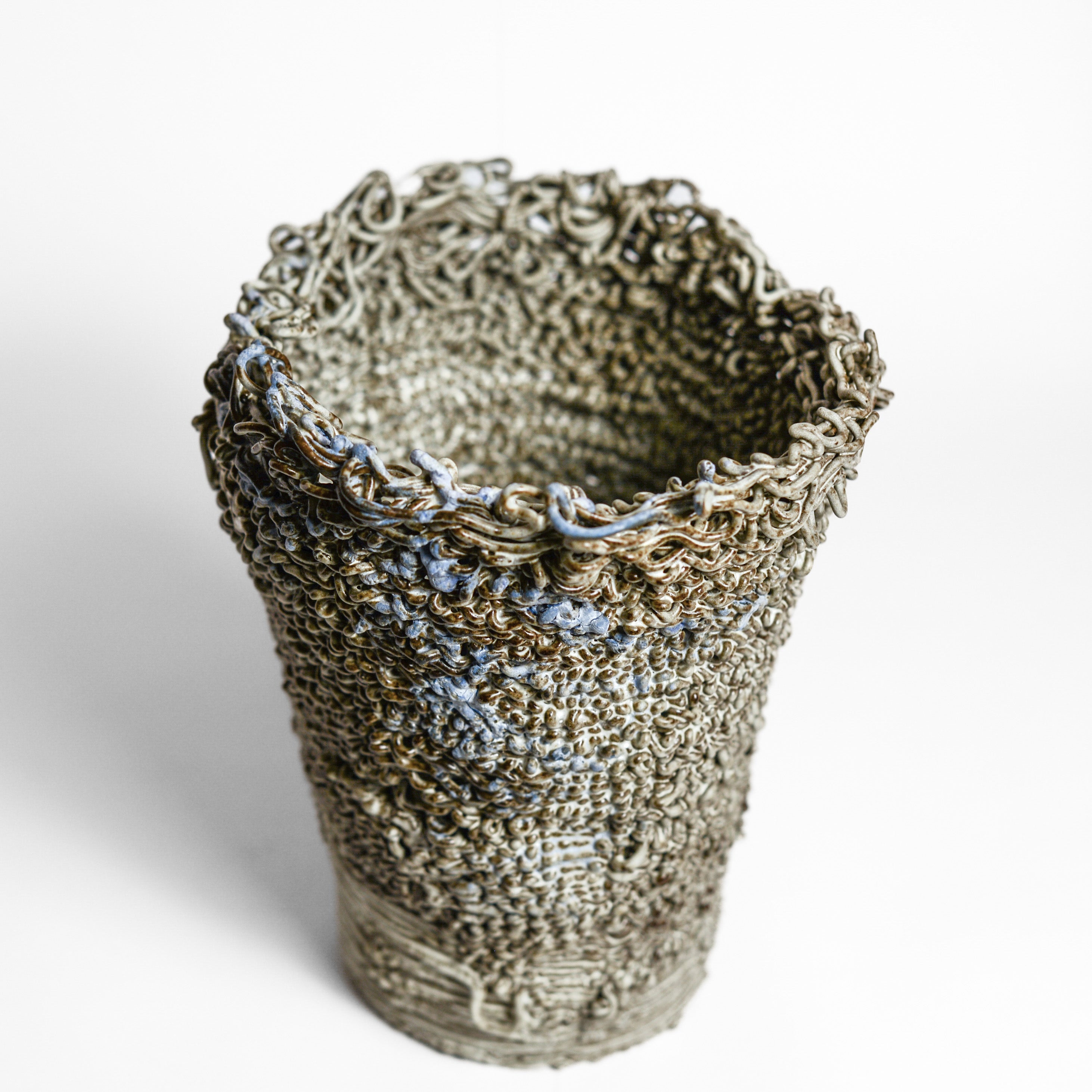 Porcelain cup made by Alterfact using 3D printing techniques in clay. Alterfact is an Australian duo composed of ceramicist Lucile Sciallano and designer Ben Landau based in Melbourne where they create contemporary ceramics using 3D printing techniques.