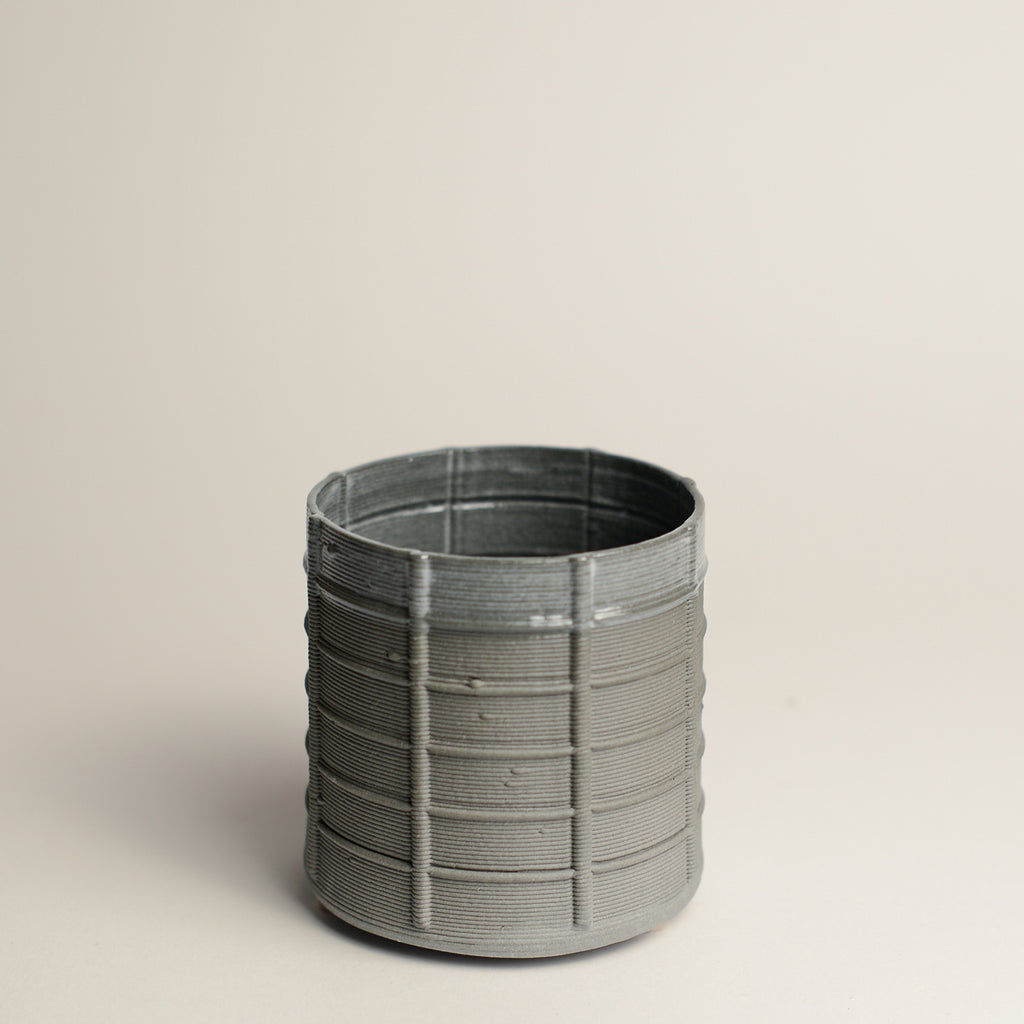 Porcelain cup made by Alterfact using 3D printing techniques in clay. Alterfact is an Australian duo composed of ceramicist Lucile Sciallano and designer Ben Landau based in Melbourne where they create contemporary ceramics using 3D printing techniques.