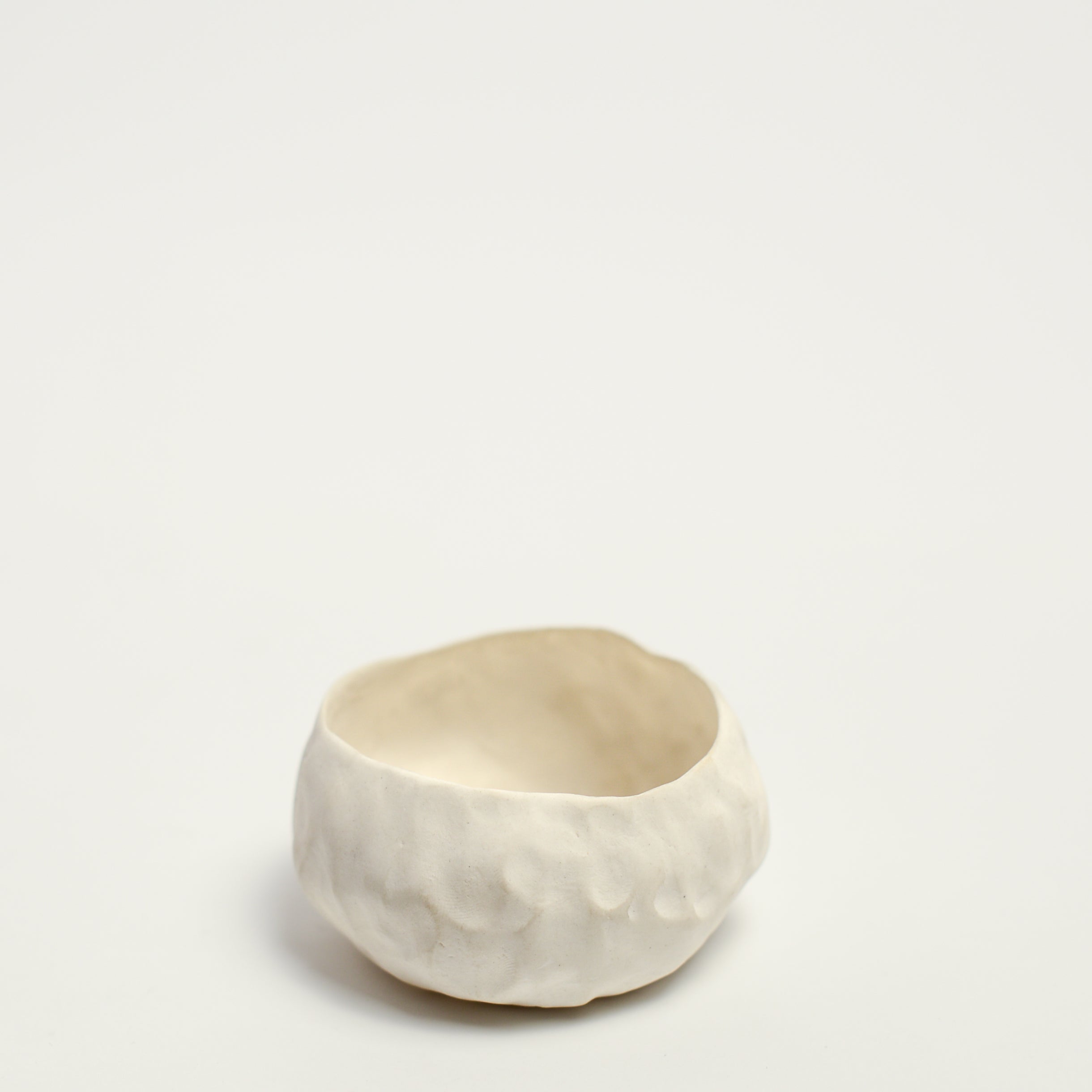 Alexandra Standen is an Australian artist who explores the potential of clay as a ceramic form; subverting the long-held association between ceramics and utilitarian function.  Standen makes things with her hands. The repetitive gesture of ‘pinching’ her hand-built forms is as much conceptual as it is an act of realisation. The conversation between materiality and form is ever evolving with intuition and experimentation in equal parts leading to the creation of these forms.