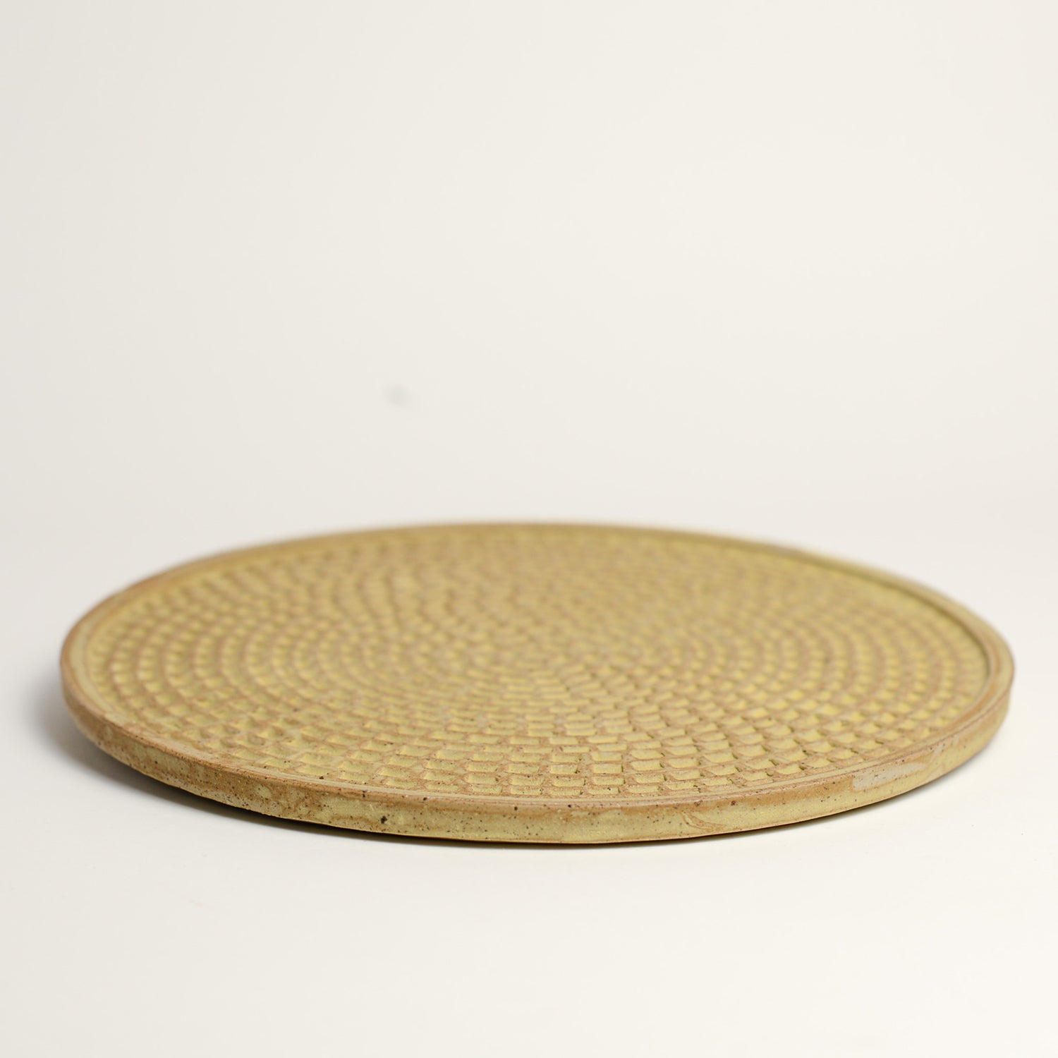 Ceramic whiskey cup handmade by Melbourne based maker eb Ceramics. This piece is part of an exclusive range created especially for pépite - all pieces were hand thrown by eb and later hand carved in a unique pattern inspired by French cobblestone roads and finished with one of three signature glaze recipes.