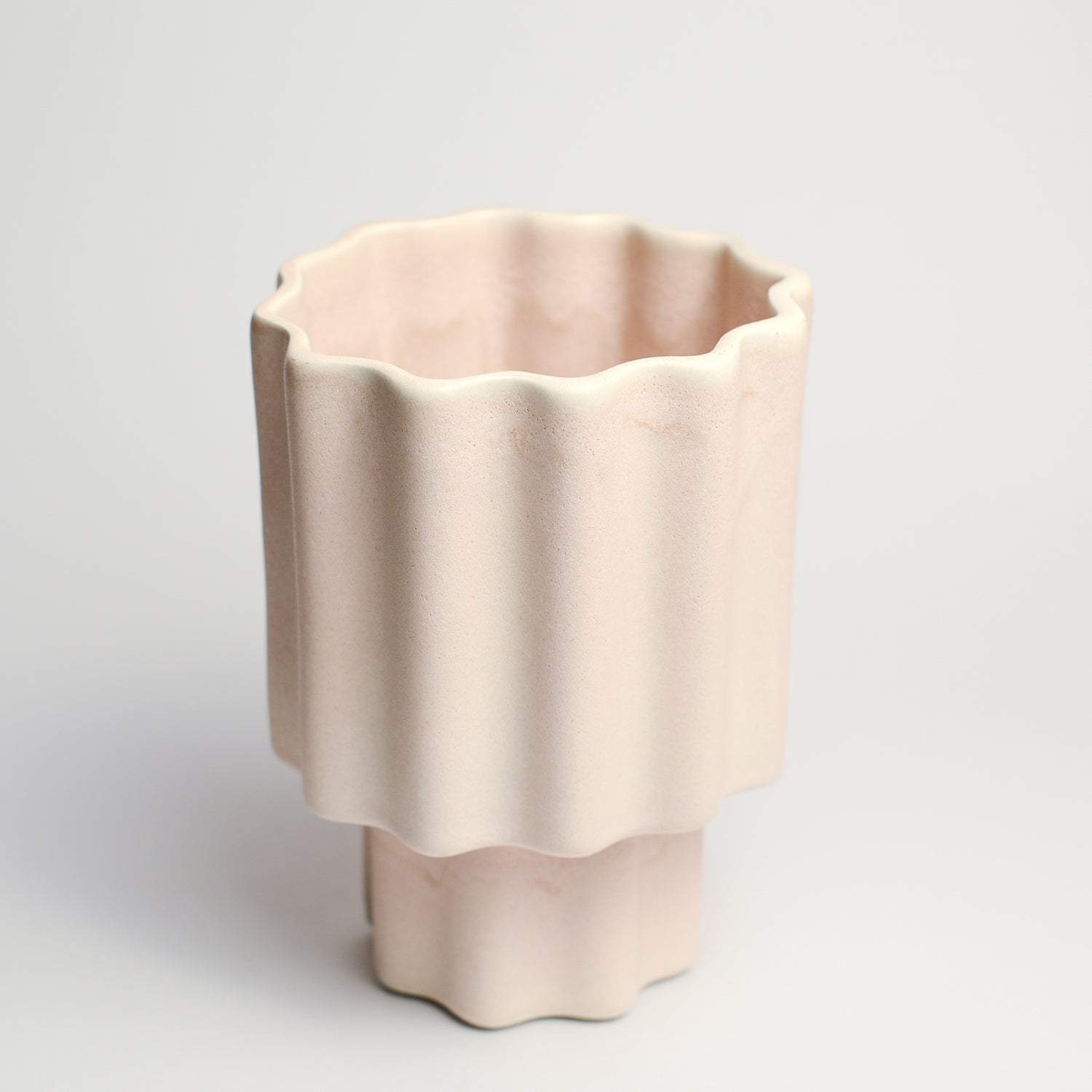 Ceramic vase handmade by Ella Reweti using slipcasting techniques. Ella is an Australian ceramicist based in Melbourne where she creates contemporary ceramics using slipcasting techniques and playing with form.