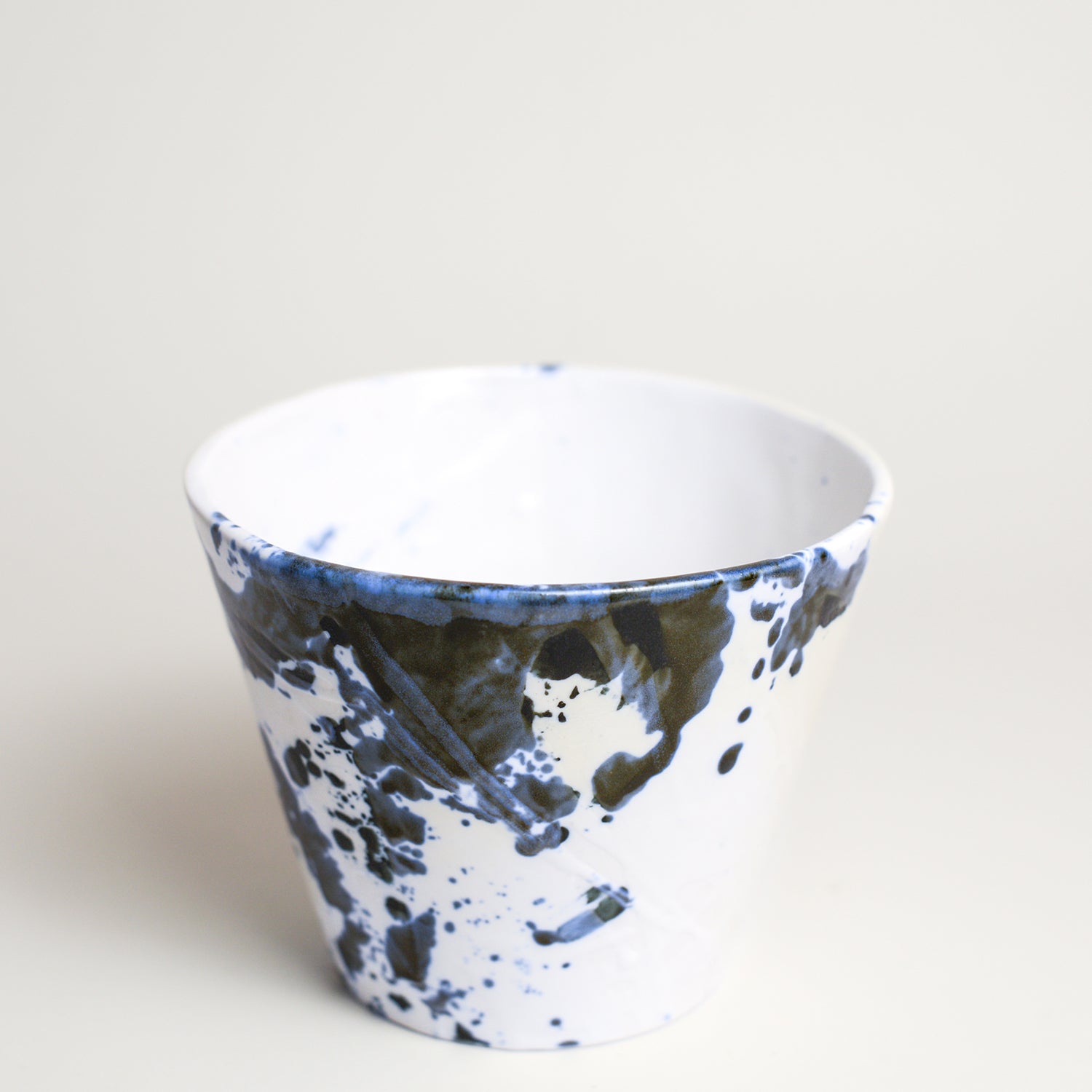Porcelain vase handmade by Melbourne-based ceramicist Lucile Sciallano from La Petite Fabrique De Brunswick. Originally from France, Lucile now works from her Brunswick garden shed where she creates a variety of tableware using slip cast techniques and hand-painted patterns.