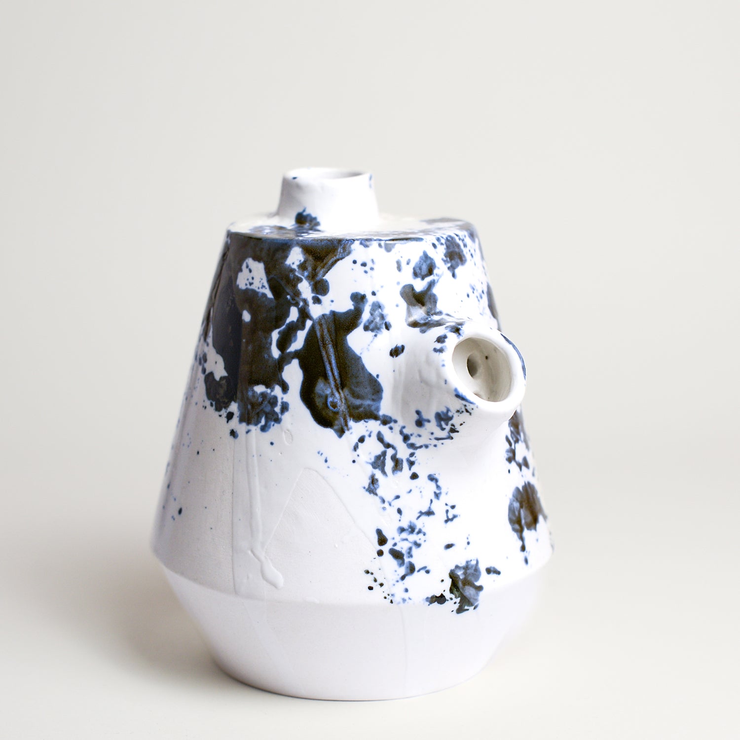 Porcelain vase handmade by Melbourne-based ceramicist Lucile Sciallano from La Petite Fabrique De Brunswick. Originally from France, Lucile now works from her Brunswick garden shed where she creates a variety of tableware using slip cast techniques and hand-painted patterns.