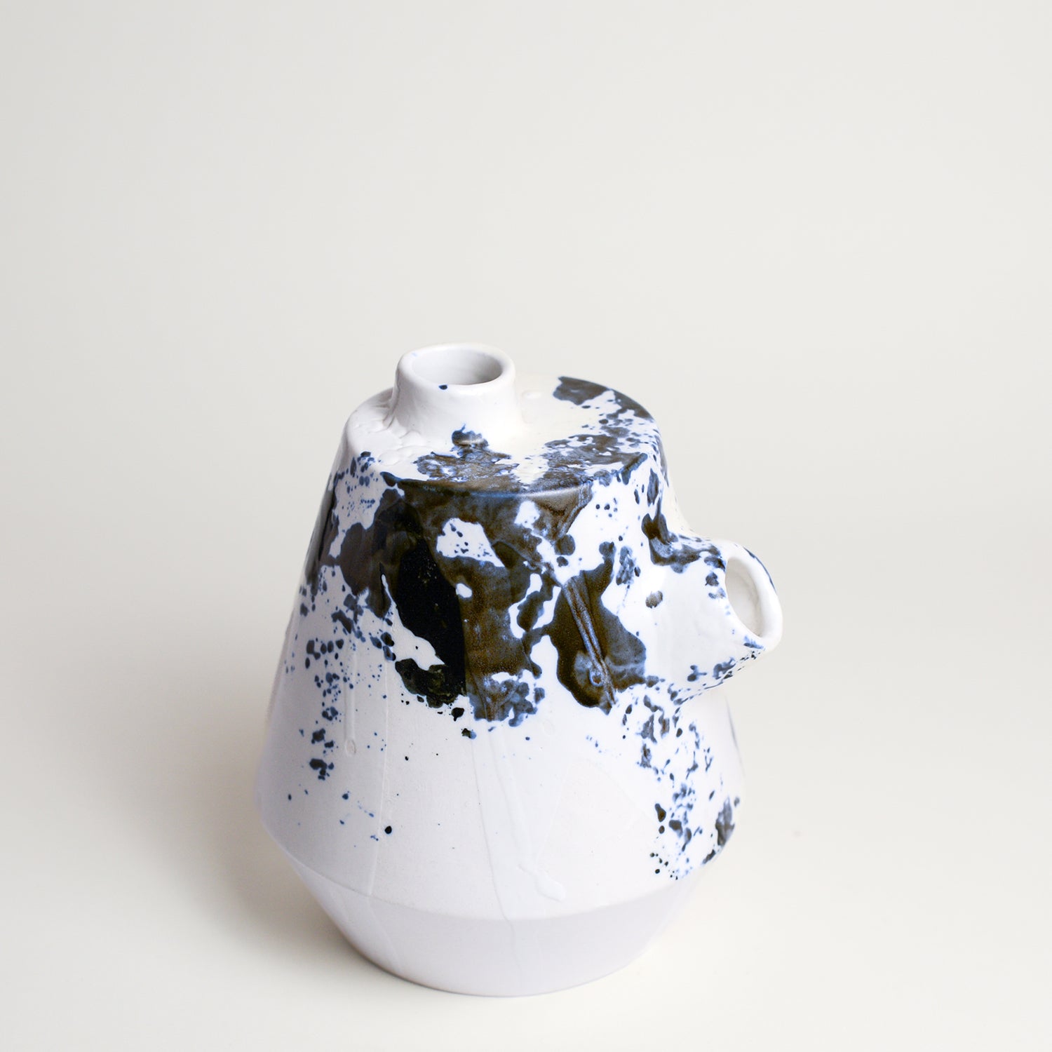 Porcelain vase handmade by Melbourne-based ceramicist Lucile Sciallano from La Petite Fabrique De Brunswick. Originally from France, Lucile now works from her Brunswick garden shed where she creates a variety of tableware using slip cast techniques and hand-painted patterns.
