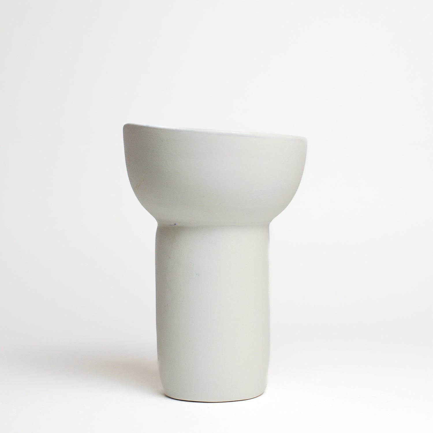 Porcelain vase handmade by Melbourne-based ceramicist Lucile Sciallano from La Petite Fabrique De Brunswick. Originally from France, Lucile now works from her Brunswick garden shed where she creates a variety of tableware using slip cast techniques and hand-painted patterns.