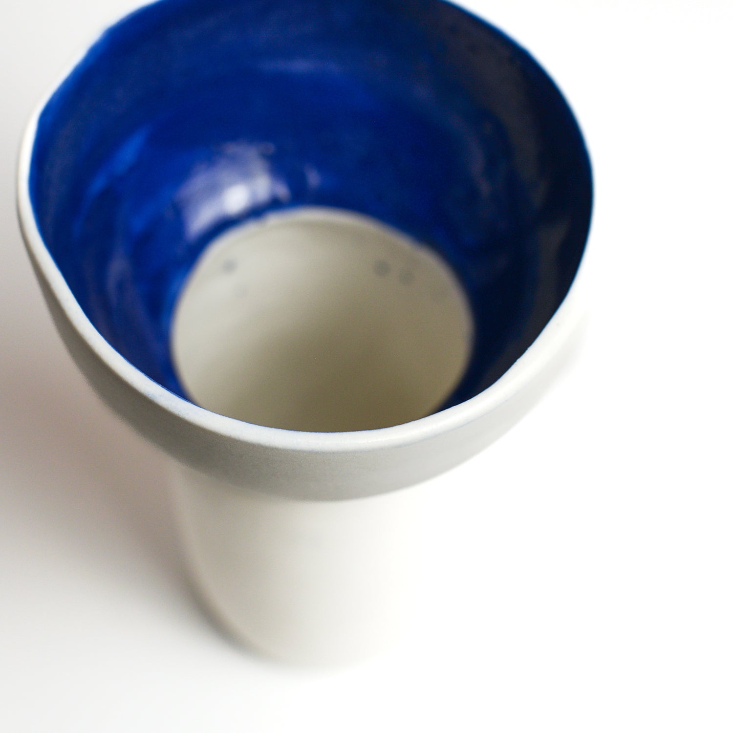 Porcelain vase handmade by Melbourne-based ceramicist Lucile Sciallano from La Petite Fabrique De Brunswick. Originally from France, Lucile now works from her Brunswick garden shed where she creates a variety of tableware using slip cast techniques and hand-painted patterns.