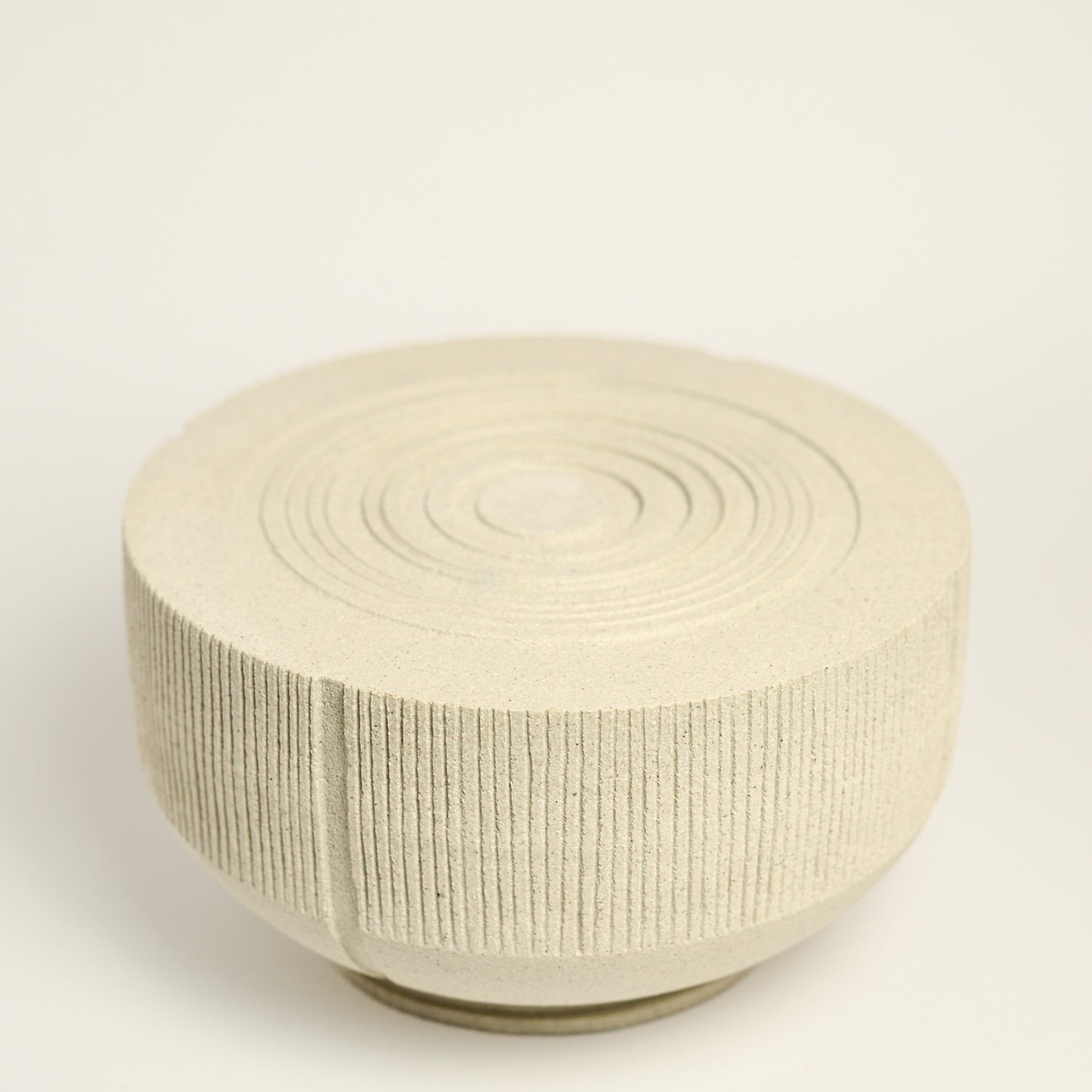 From her small studio in the Dandenong Ranges, Melinda Wallis strives for beauty in the form and surface. Simple designs can prove challenging, however this keeps her engaged as she continues to search for that one perfect piece. that enigma. She uses textured clays, often blending two or three together. The wheel gives Melinda her individual parts, and her hands assemble the finished product. The process is by far the main event for Melinda.