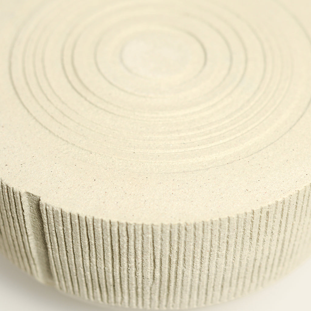 From her small studio in the Dandenong Ranges, Melinda Wallis strives for beauty in the form and surface. Simple designs can prove challenging, however this keeps her engaged as she continues to search for that one perfect piece. that enigma. She uses textured clays, often blending two or three together. The wheel gives Melinda her individual parts, and her hands assemble the finished product. The process is by far the main event for Melinda.