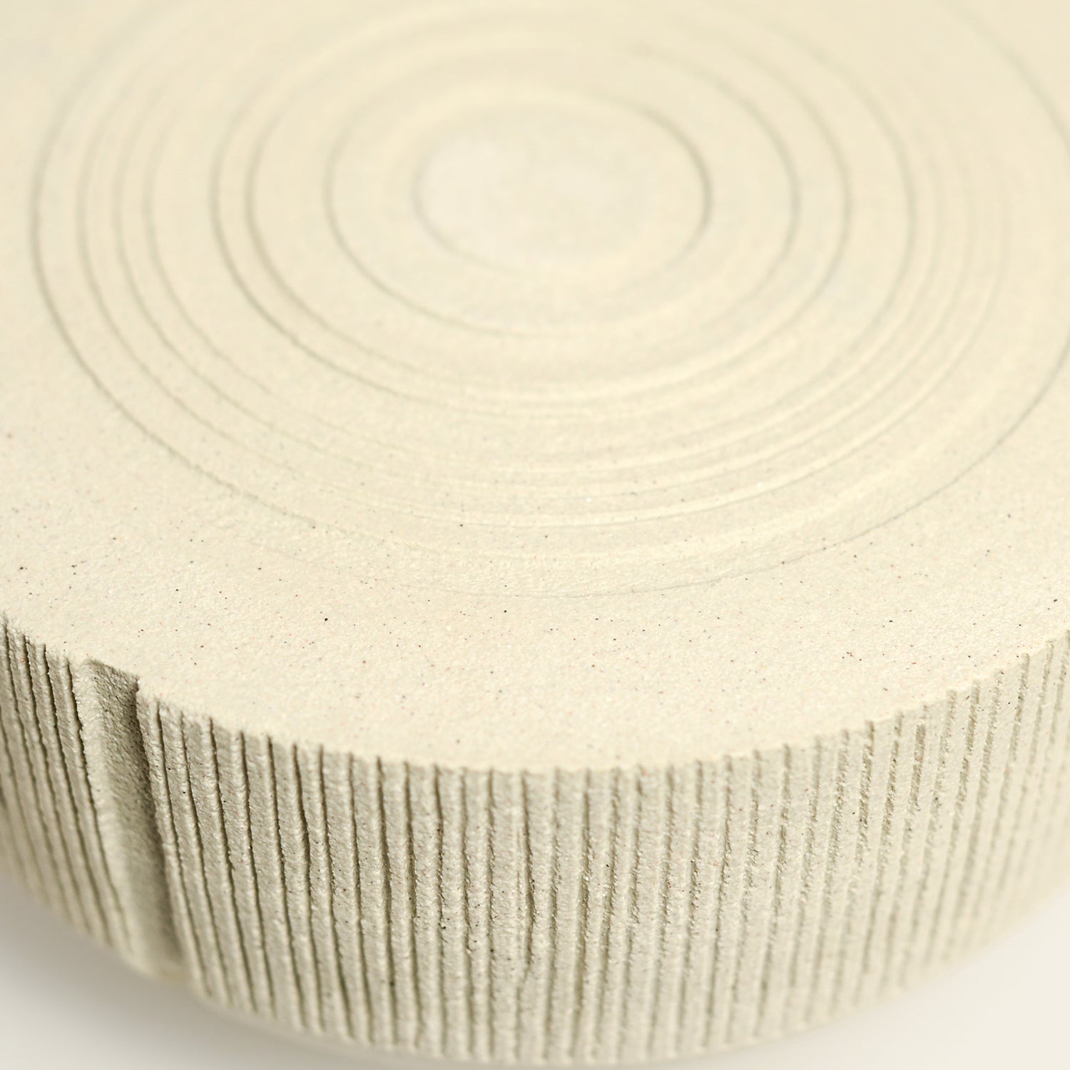 From her small studio in the Dandenong Ranges, Melinda Wallis strives for beauty in the form and surface. Simple designs can prove challenging, however this keeps her engaged as she continues to search for that one perfect piece. that enigma. She uses textured clays, often blending two or three together. The wheel gives Melinda her individual parts, and her hands assemble the finished product. The process is by far the main event for Melinda.