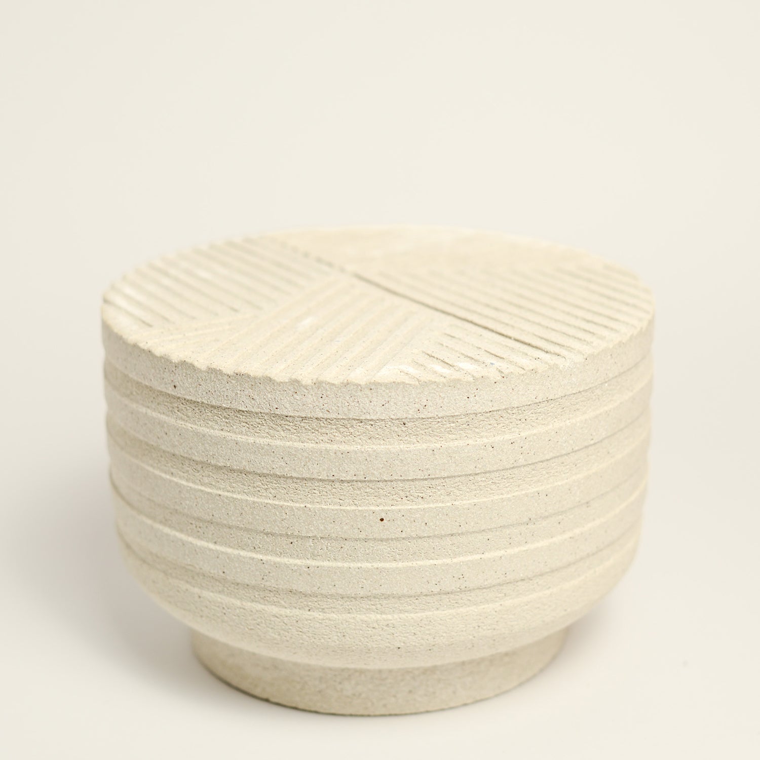 From her small studio in the Dandenong Ranges, Melinda Wallis strives for beauty in the form and surface. Simple designs can prove challenging, however this keeps her engaged as she continues to search for that one perfect piece. that enigma. She uses textured clays, often blending two or three together. The wheel gives Melinda her individual parts, and her hands assemble the finished product. The process is by far the main event for Melinda.