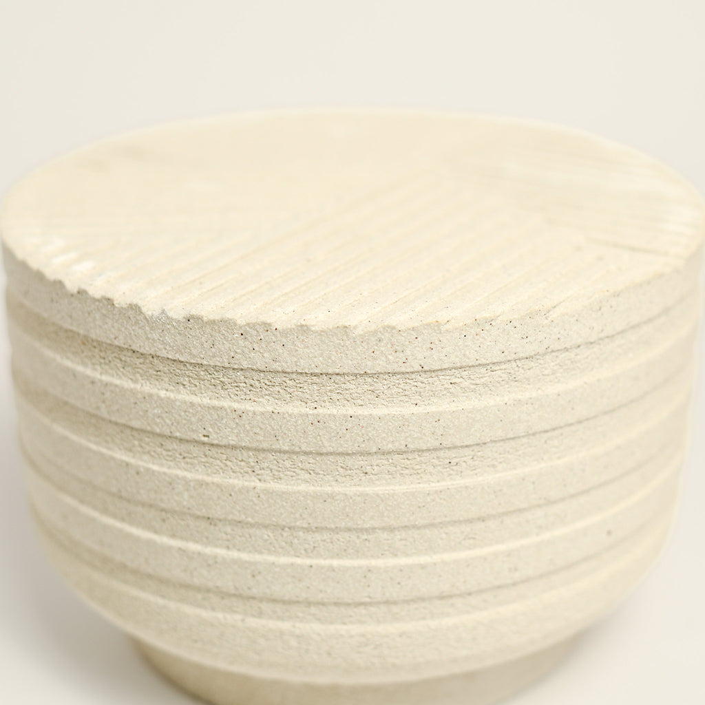 From her small studio in the Dandenong Ranges, Melinda Wallis strives for beauty in the form and surface. Simple designs can prove challenging, however this keeps her engaged as she continues to search for that one perfect piece. that enigma. She uses textured clays, often blending two or three together. The wheel gives Melinda her individual parts, and her hands assemble the finished product. The process is by far the main event for Melinda.