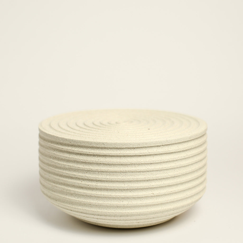 From her small studio in the Dandenong Ranges, Melinda Wallis strives for beauty in the form and surface. Simple designs can prove challenging, however this keeps her engaged as she continues to search for that one perfect piece. that enigma. She uses textured clays, often blending two or three together. The wheel gives Melinda her individual parts, and her hands assemble the finished product. The process is by far the main event for Melinda.