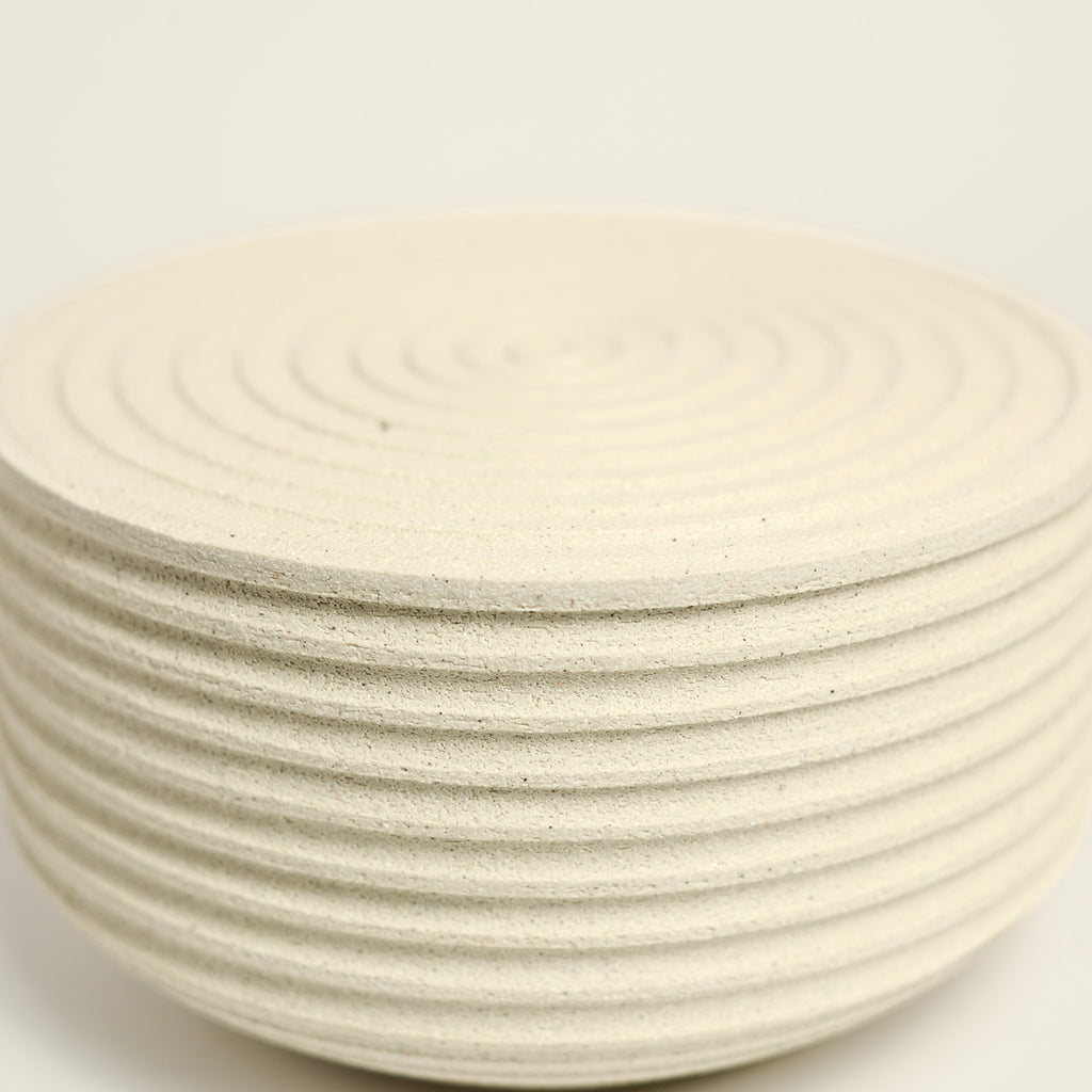 From her small studio in the Dandenong Ranges, Melinda Wallis strives for beauty in the form and surface. Simple designs can prove challenging, however this keeps her engaged as she continues to search for that one perfect piece. that enigma. She uses textured clays, often blending two or three together. The wheel gives Melinda her individual parts, and her hands assemble the finished product. The process is by far the main event for Melinda.