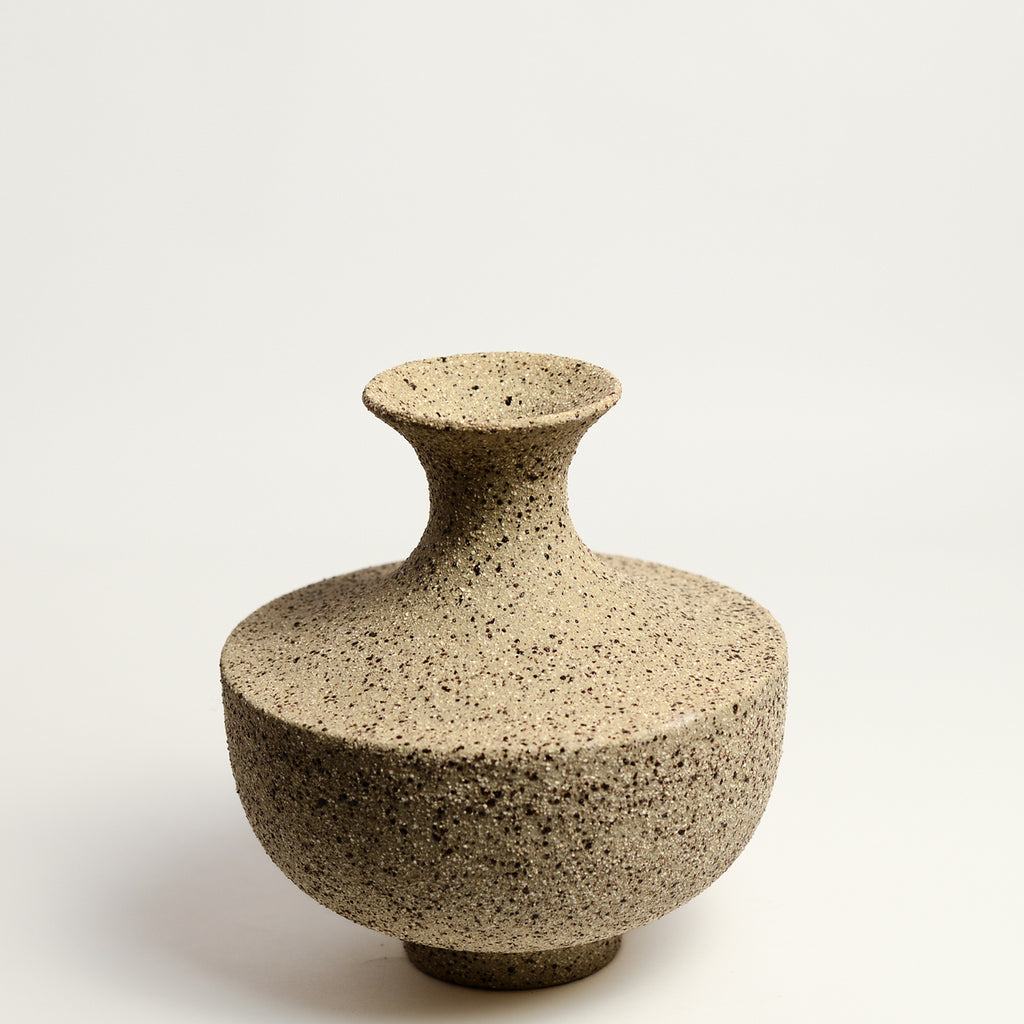 From her small studio in the Dandenong Ranges, Melinda Wallis strives for beauty in the form and surface. Simple designs can prove challenging, however this keeps her engaged as she continues to search for that one perfect piece. that enigma. She uses textured clays, often blending two or three together. The wheel gives Melinda her individual parts, and her hands assemble the finished product. The process is by far the main event for Melinda.