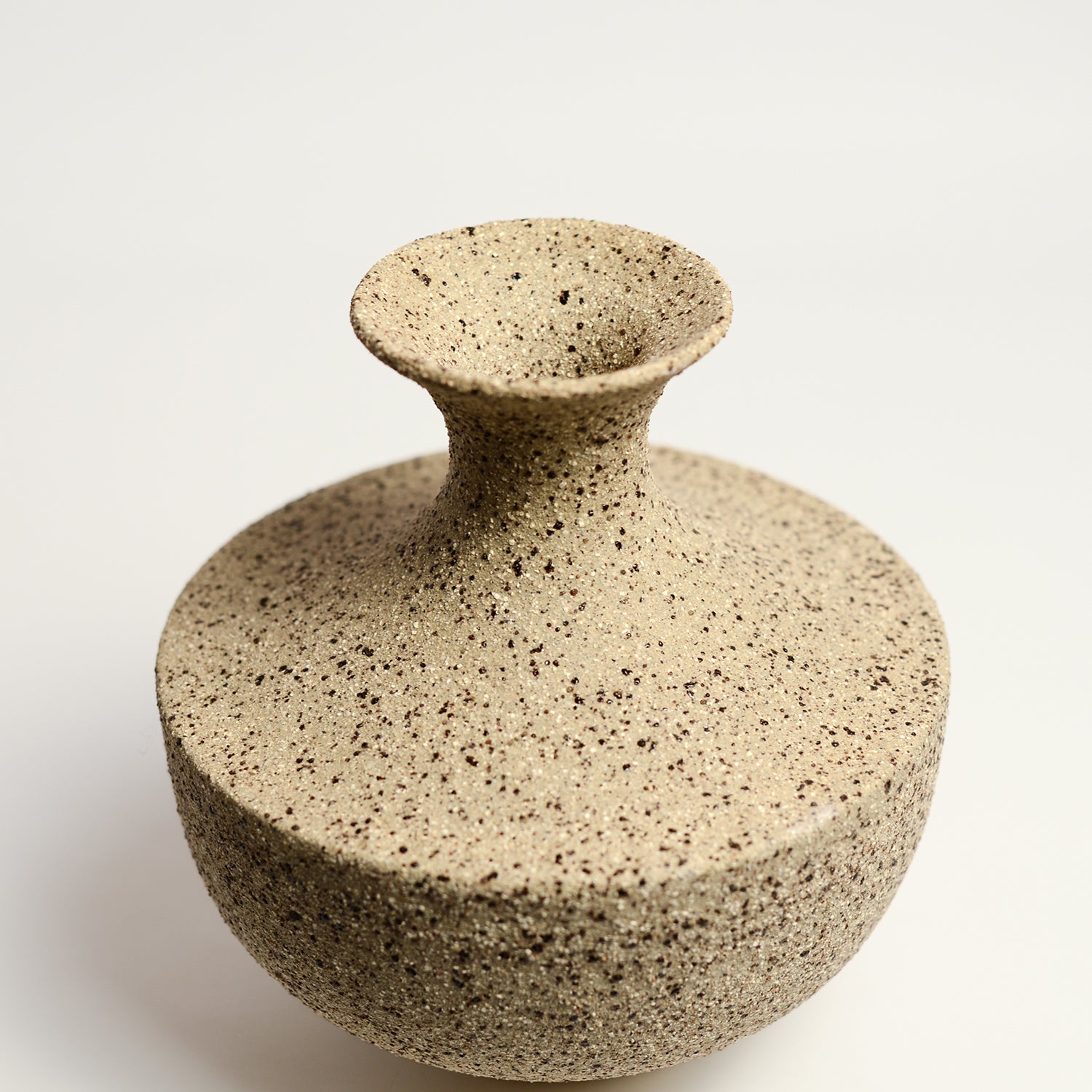 From her small studio in the Dandenong Ranges, Melinda Wallis strives for beauty in the form and surface. Simple designs can prove challenging, however this keeps her engaged as she continues to search for that one perfect piece. that enigma. She uses textured clays, often blending two or three together. The wheel gives Melinda her individual parts, and her hands assemble the finished product. The process is by far the main event for Melinda.