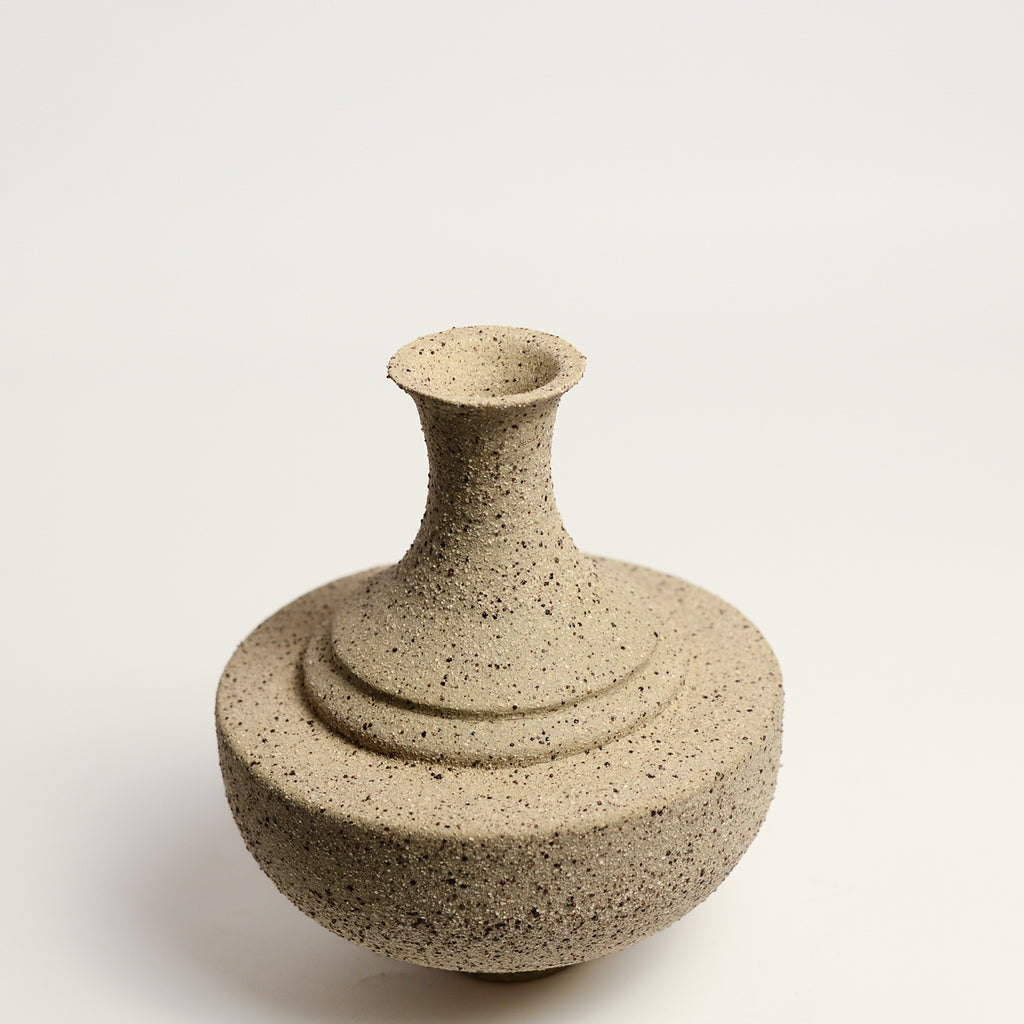 From her small studio in the Dandenong Ranges, Melinda Wallis strives for beauty in the form and surface. Simple designs can prove challenging, however this keeps her engaged as she continues to search for that one perfect piece. that enigma. She uses textured clays, often blending two or three together. The wheel gives Melinda her individual parts, and her hands assemble the finished product. The process is by far the main event for Melinda.