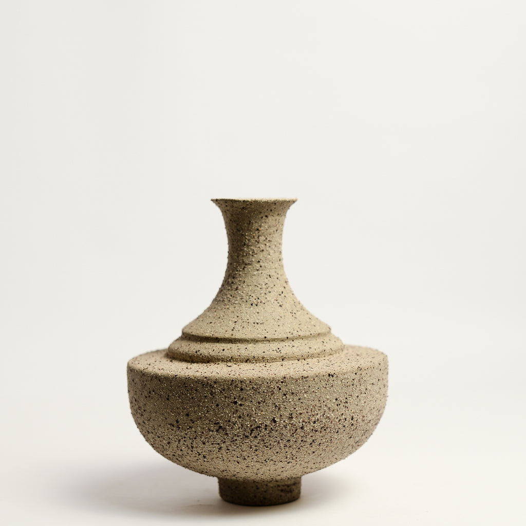 From her small studio in the Dandenong Ranges, Melinda Wallis strives for beauty in the form and surface. Simple designs can prove challenging, however this keeps her engaged as she continues to search for that one perfect piece. that enigma. She uses textured clays, often blending two or three together. The wheel gives Melinda her individual parts, and her hands assemble the finished product. The process is by far the main event for Melinda.