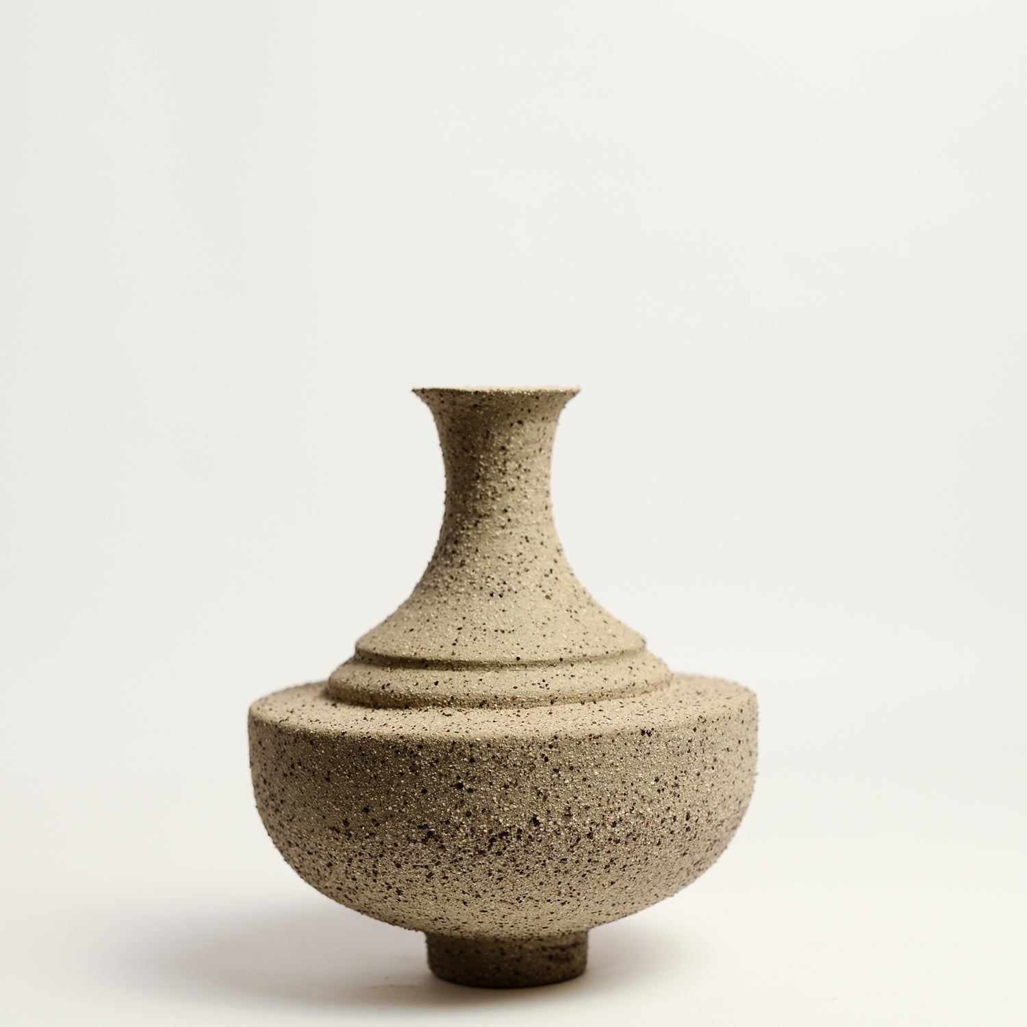 From her small studio in the Dandenong Ranges, Melinda Wallis strives for beauty in the form and surface. Simple designs can prove challenging, however this keeps her engaged as she continues to search for that one perfect piece. that enigma. She uses textured clays, often blending two or three together. The wheel gives Melinda her individual parts, and her hands assemble the finished product. The process is by far the main event for Melinda.