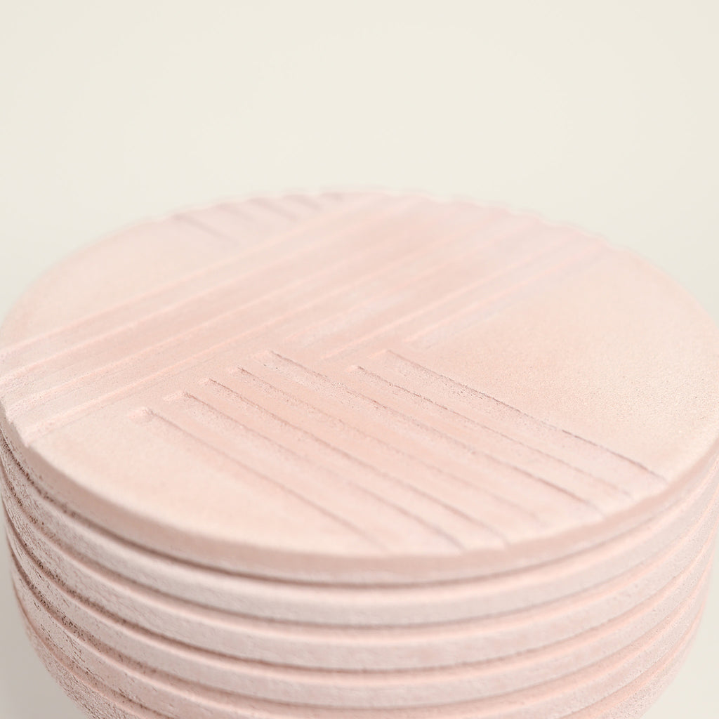 From her small studio in the Dandenong Ranges, Melinda Wallis strives for beauty in the form and surface. Simple designs can prove challenging, however this keeps her engaged as she continues to search for that one perfect piece. that enigma. She uses textured clays, often blending two or three together. The wheel gives Melinda her individual parts, and her hands assemble the finished product. The process is by far the main event for Melinda.