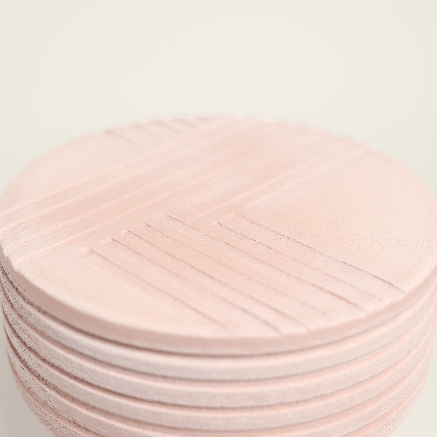 From her small studio in the Dandenong Ranges, Melinda Wallis strives for beauty in the form and surface. Simple designs can prove challenging, however this keeps her engaged as she continues to search for that one perfect piece. that enigma. She uses textured clays, often blending two or three together. The wheel gives Melinda her individual parts, and her hands assemble the finished product. The process is by far the main event for Melinda.