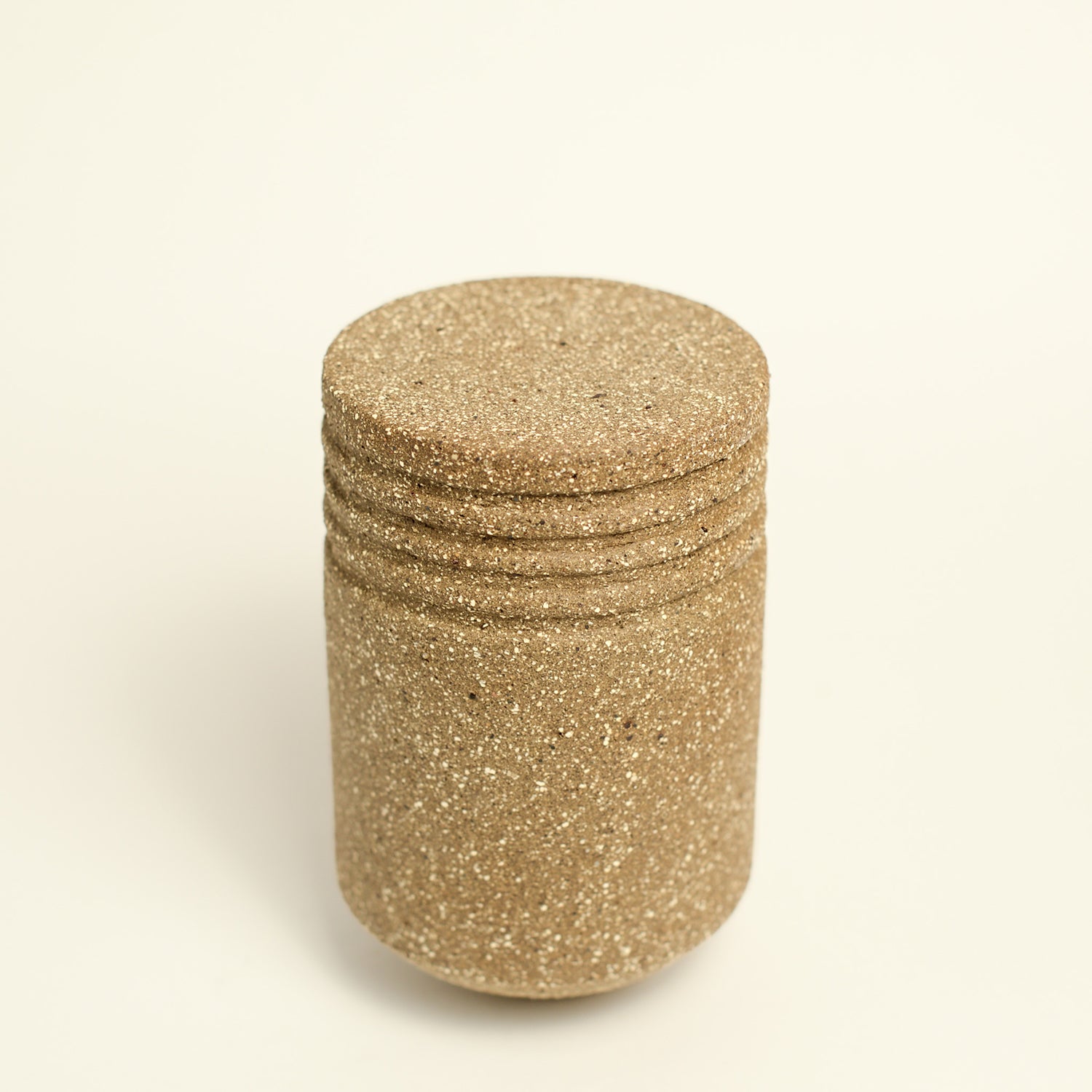 From her small studio in the Dandenong Ranges, Melinda Wallis strives for beauty in the form and surface. Simple designs can prove challenging, however this keeps her engaged as she continues to search for that one perfect piece. that enigma. She uses textured clays, often blending two or three together. The wheel gives Melinda her individual parts, and her hands assemble the finished product. The process is by far the main event for Melinda.