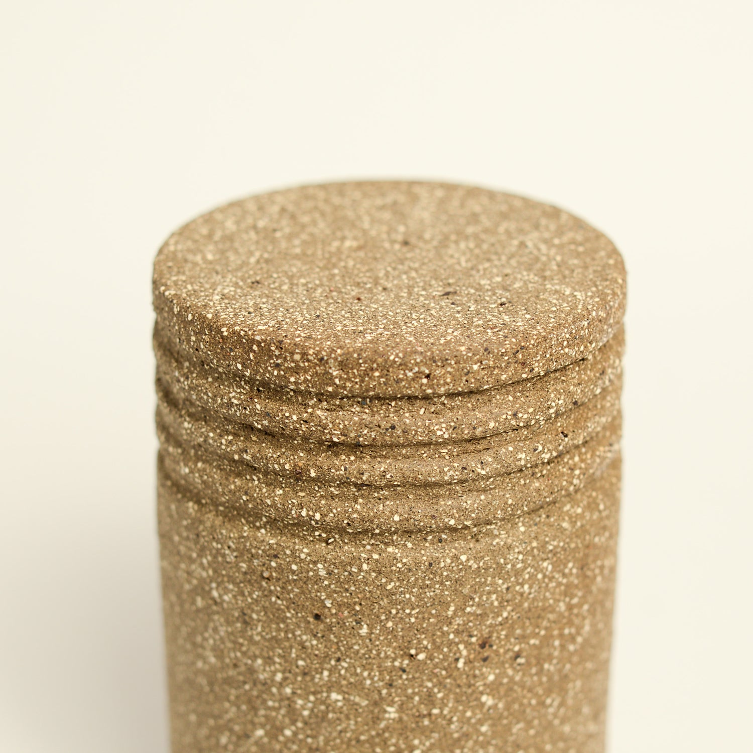 From her small studio in the Dandenong Ranges, Melinda Wallis strives for beauty in the form and surface. Simple designs can prove challenging, however this keeps her engaged as she continues to search for that one perfect piece. that enigma. She uses textured clays, often blending two or three together. The wheel gives Melinda her individual parts, and her hands assemble the finished product. The process is by far the main event for Melinda.