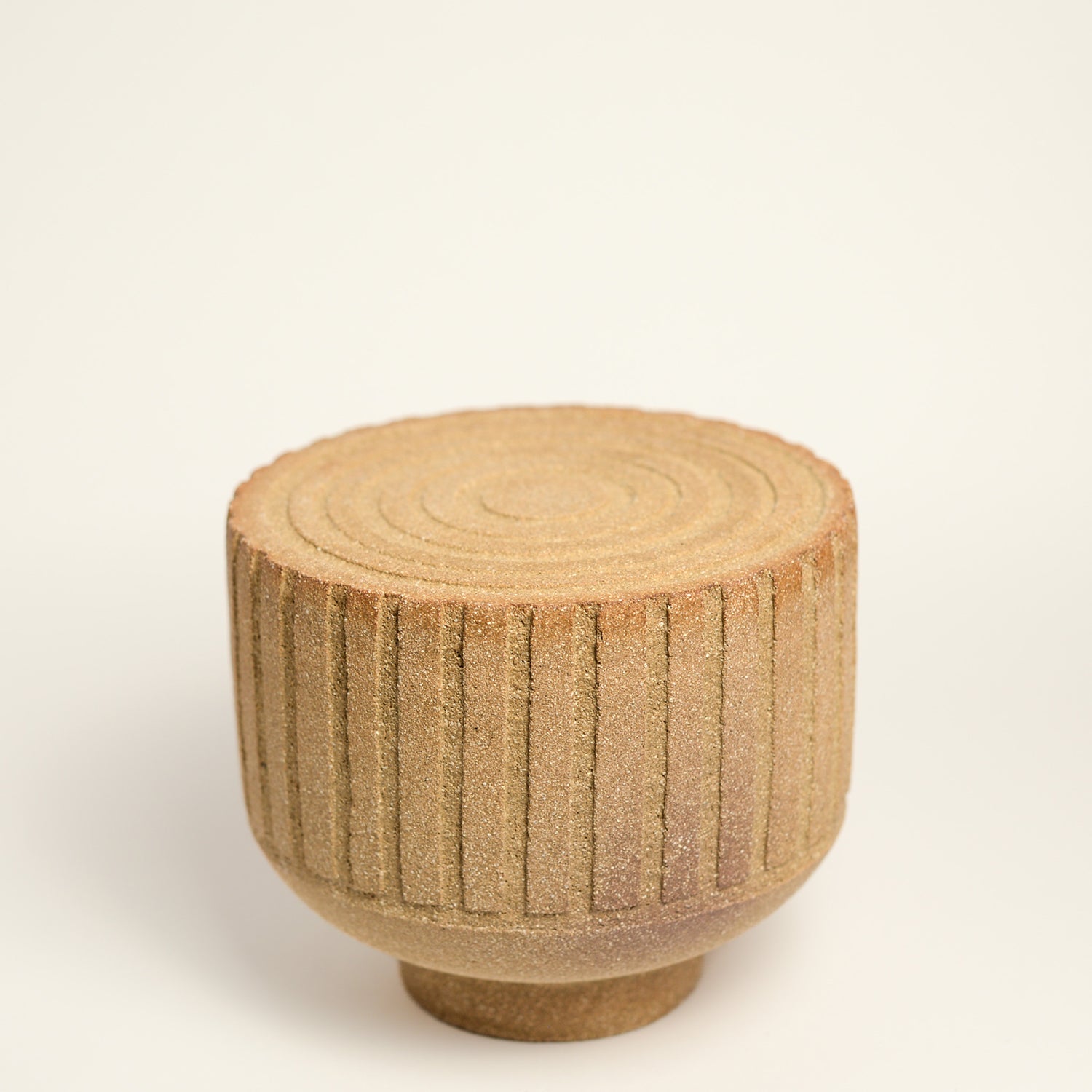 From her small studio in the Dandenong Ranges, Melinda Wallis strives for beauty in the form and surface. Simple designs can prove challenging, however this keeps her engaged as she continues to search for that one perfect piece. that enigma. She uses textured clays, often blending two or three together. The wheel gives Melinda her individual parts, and her hands assemble the finished product. The process is by far the main event for Melinda.