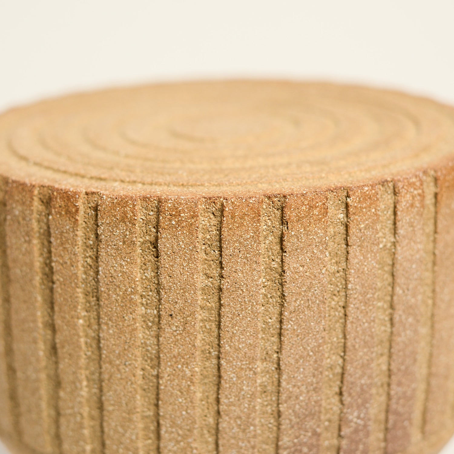 From her small studio in the Dandenong Ranges, Melinda Wallis strives for beauty in the form and surface. Simple designs can prove challenging, however this keeps her engaged as she continues to search for that one perfect piece. that enigma. She uses textured clays, often blending two or three together. The wheel gives Melinda her individual parts, and her hands assemble the finished product. The process is by far the main event for Melinda.