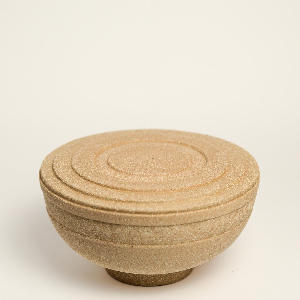 From her small studio in the Dandenong Ranges, Melinda Wallis strives for beauty in the form and surface. Simple designs can prove challenging, however this keeps her engaged as she continues to search for that one perfect piece. that enigma. She uses textured clays, often blending two or three together. The wheel gives Melinda her individual parts, and her hands assemble the finished product. The process is by far the main event for Melinda.