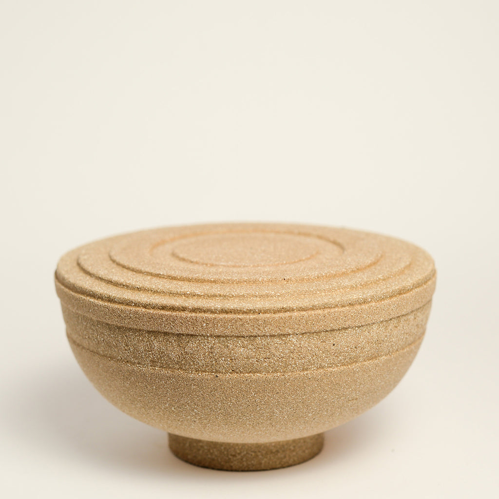 From her small studio in the Dandenong Ranges, Melinda Wallis strives for beauty in the form and surface. Simple designs can prove challenging, however this keeps her engaged as she continues to search for that one perfect piece. that enigma. She uses textured clays, often blending two or three together. The wheel gives Melinda her individual parts, and her hands assemble the finished product. The process is by far the main event for Melinda.