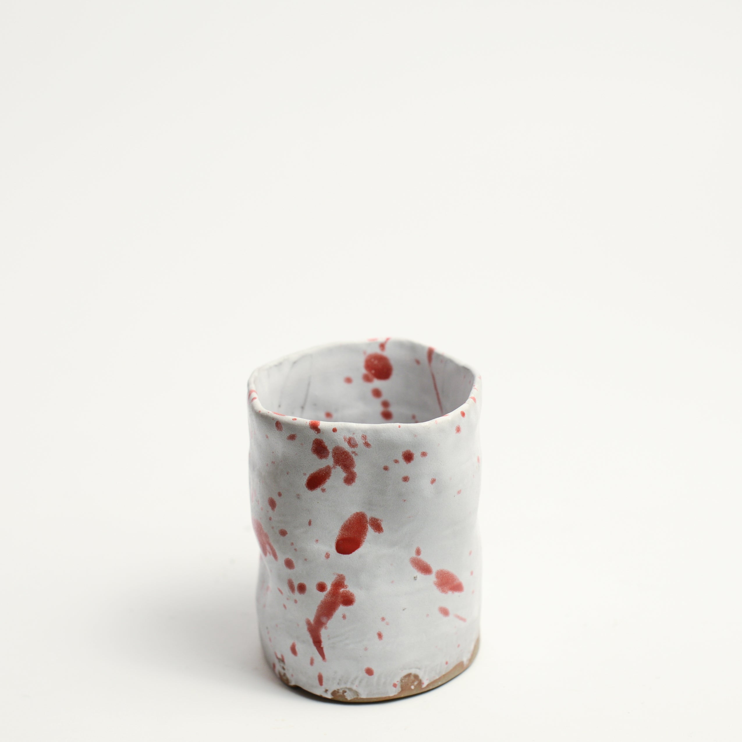 Ceramic cup handmade by Melbourne-based artist and designer Nathan M. Collis. With a background in graphic design informing his bold and assertive sculptural displays, Nathan creates contemporary ceramics using handbuilding techniques and meticulous hand-painted patterns.