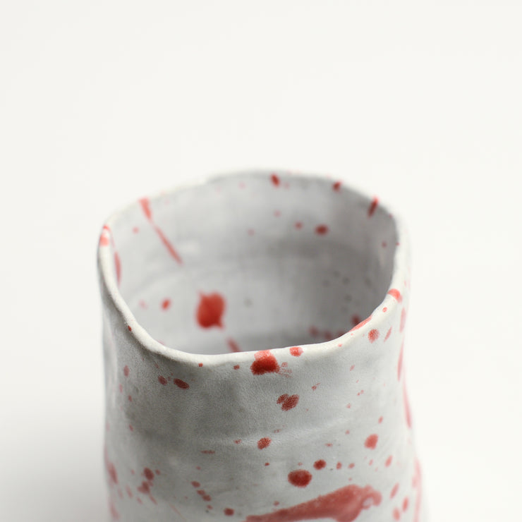 Ceramic cup handmade by Melbourne-based artist and designer Nathan M. Collis. With a background in graphic design informing his bold and assertive sculptural displays, Nathan creates contemporary ceramics using handbuilding techniques and meticulous hand-painted patterns.