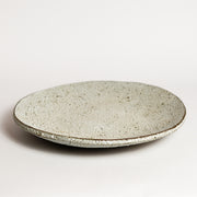 Ceramic platter handmade by London born, Melbourne based potter Sharon Alpren. Sharon makes sculptural, yet practical pieces for the home. The characteristics of the clay, the glaze and the fire direct her hand-built and wheel-thrown contemporary ceramics. 