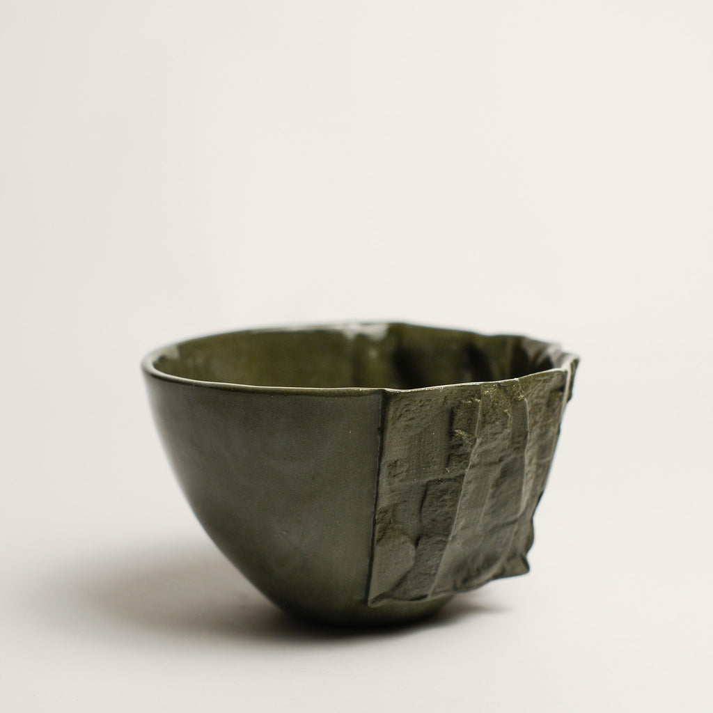 Small porcelain vase handmade by Perth-based ceramicist Annemieke Mulders. Inspired by elements found in nature, Annemieke predominantly works with slipcasting techniques to create contemporary ceramics with interesting forms and tactile surfaces using fine porcelain and stoneware clays. 