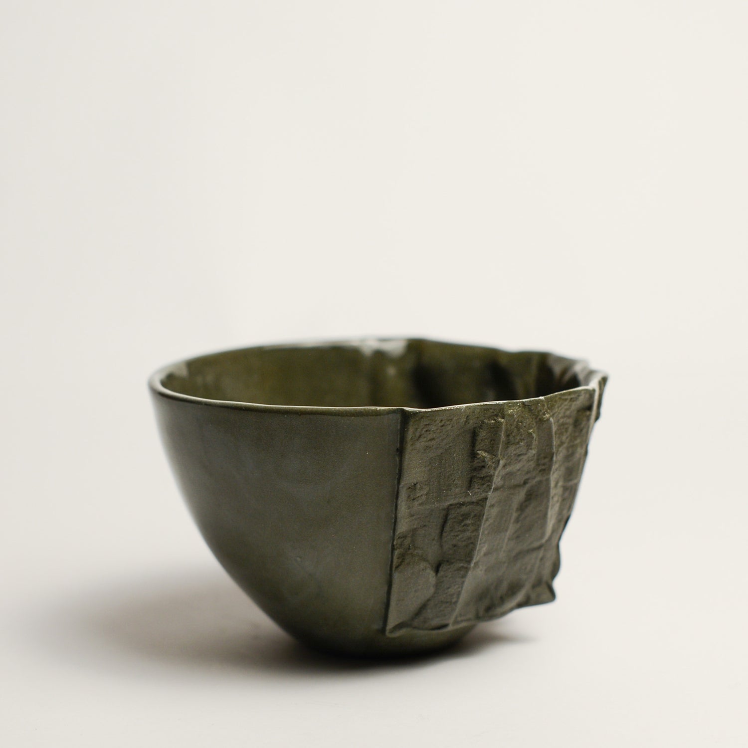 Small porcelain vase handmade by Perth-based ceramicist Annemieke Mulders. Inspired by elements found in nature, Annemieke predominantly works with slipcasting techniques to create contemporary ceramics with interesting forms and tactile surfaces using fine porcelain and stoneware clays. 