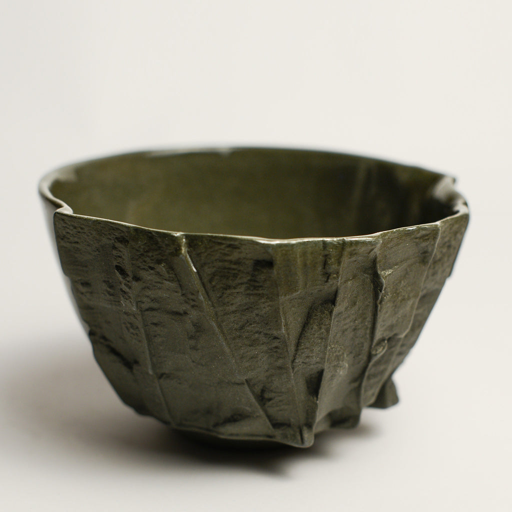 Small porcelain vase handmade by Perth-based ceramicist Annemieke Mulders. Inspired by elements found in nature, Annemieke predominantly works with slipcasting techniques to create contemporary ceramics with interesting forms and tactile surfaces using fine porcelain and stoneware clays. 