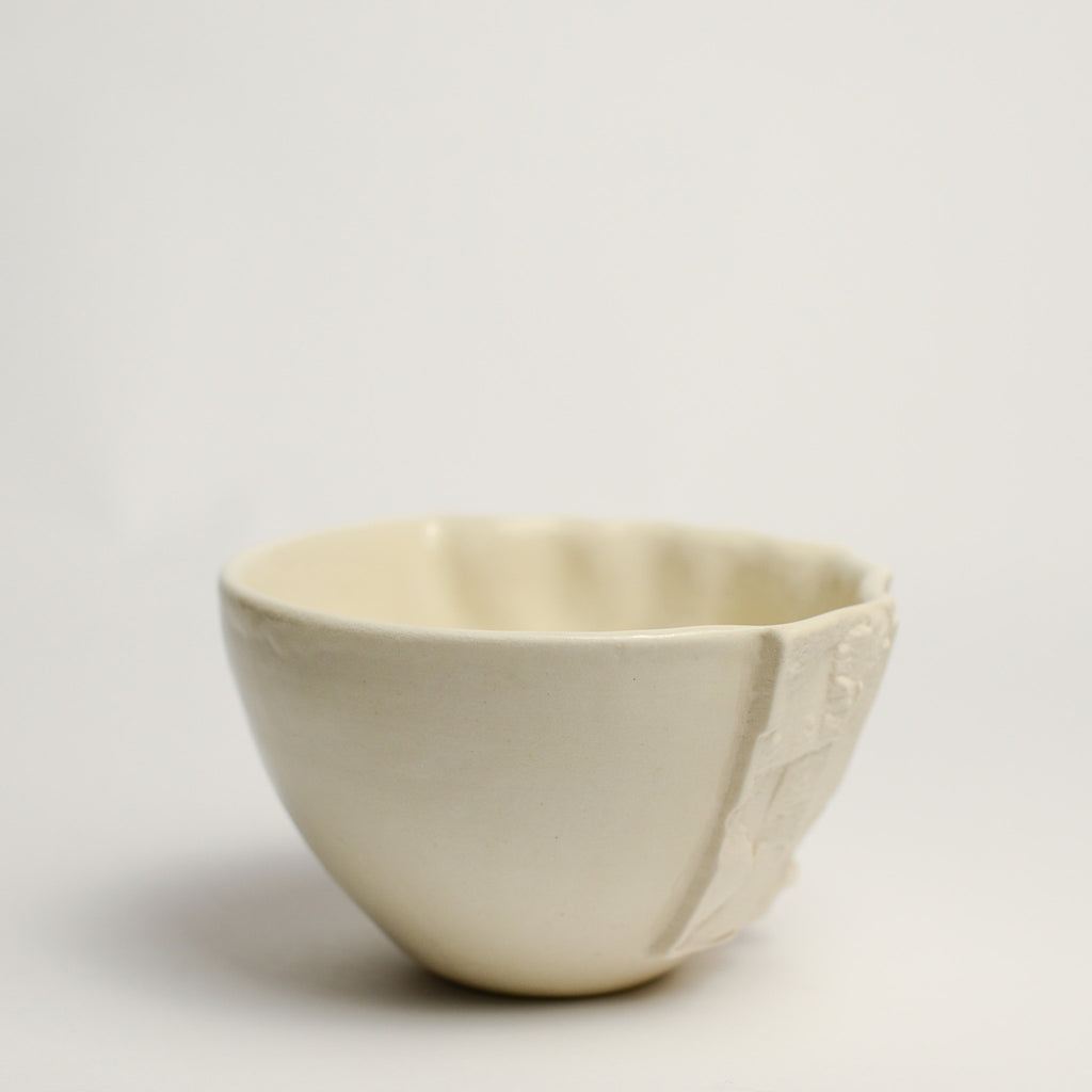 Small porcelain vase handmade by Perth-based ceramicist Annemieke Mulders. Inspired by elements found in nature, Annemieke predominantly works with slipcasting techniques to create contemporary ceramics with interesting forms and tactile surfaces using fine porcelain and stoneware clays. 