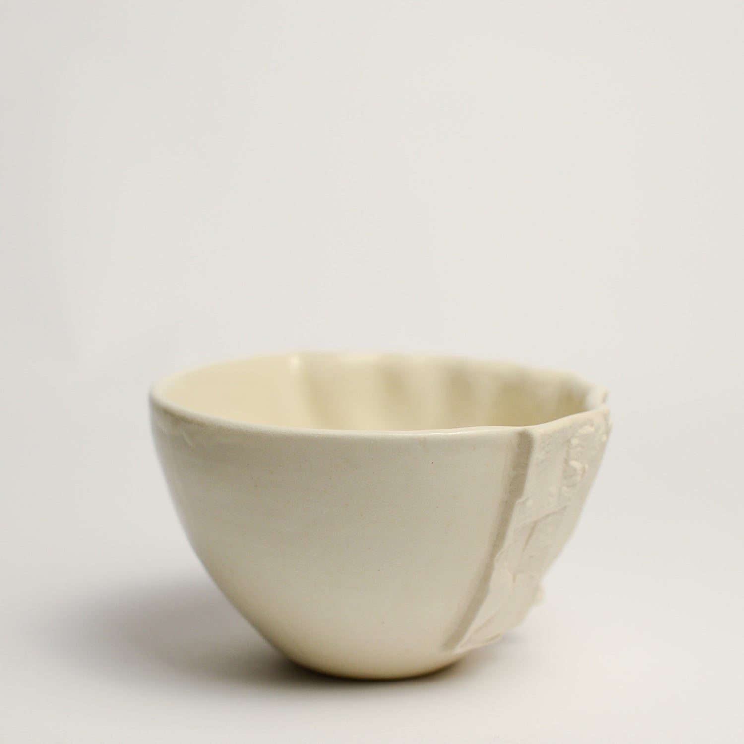 Small porcelain vase handmade by Perth-based ceramicist Annemieke Mulders. Inspired by elements found in nature, Annemieke predominantly works with slipcasting techniques to create contemporary ceramics with interesting forms and tactile surfaces using fine porcelain and stoneware clays. 