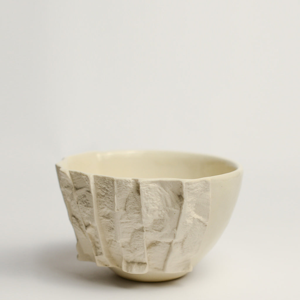 Small porcelain vase handmade by Perth-based ceramicist Annemieke Mulders. Inspired by elements found in nature, Annemieke predominantly works with slipcasting techniques to create contemporary ceramics with interesting forms and tactile surfaces using fine porcelain and stoneware clays. 