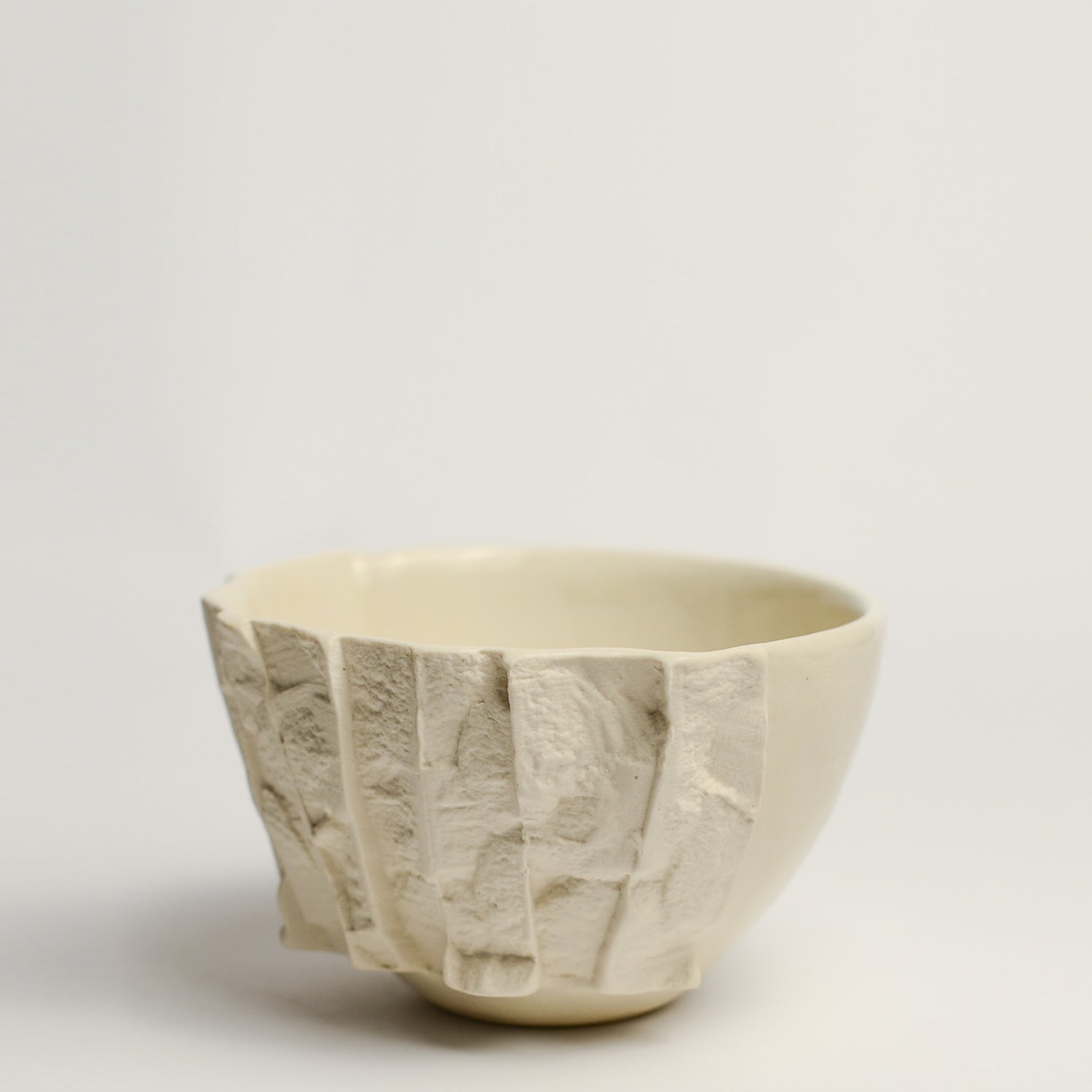 Small porcelain vase handmade by Perth-based ceramicist Annemieke Mulders. Inspired by elements found in nature, Annemieke predominantly works with slipcasting techniques to create contemporary ceramics with interesting forms and tactile surfaces using fine porcelain and stoneware clays. 