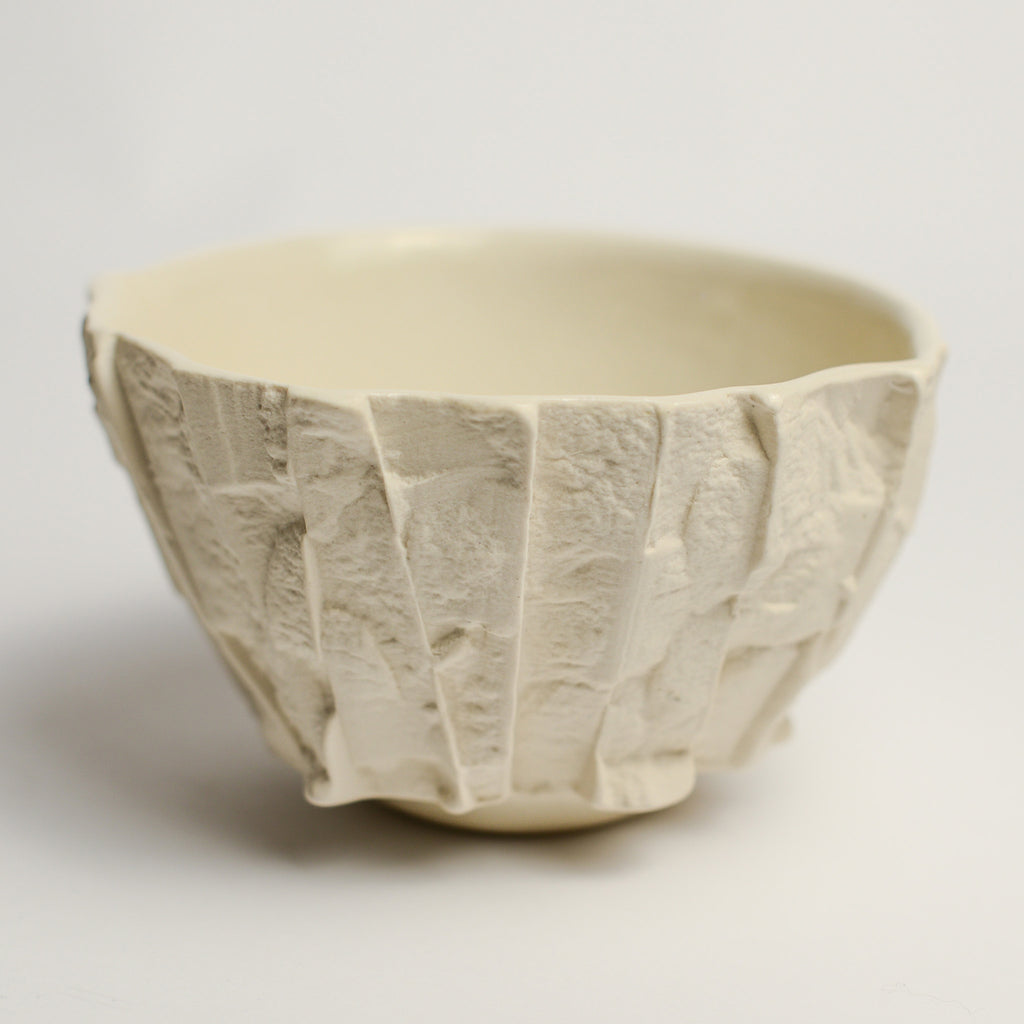 Small porcelain vase handmade by Perth-based ceramicist Annemieke Mulders. Inspired by elements found in nature, Annemieke predominantly works with slipcasting techniques to create contemporary ceramics with interesting forms and tactile surfaces using fine porcelain and stoneware clays. 