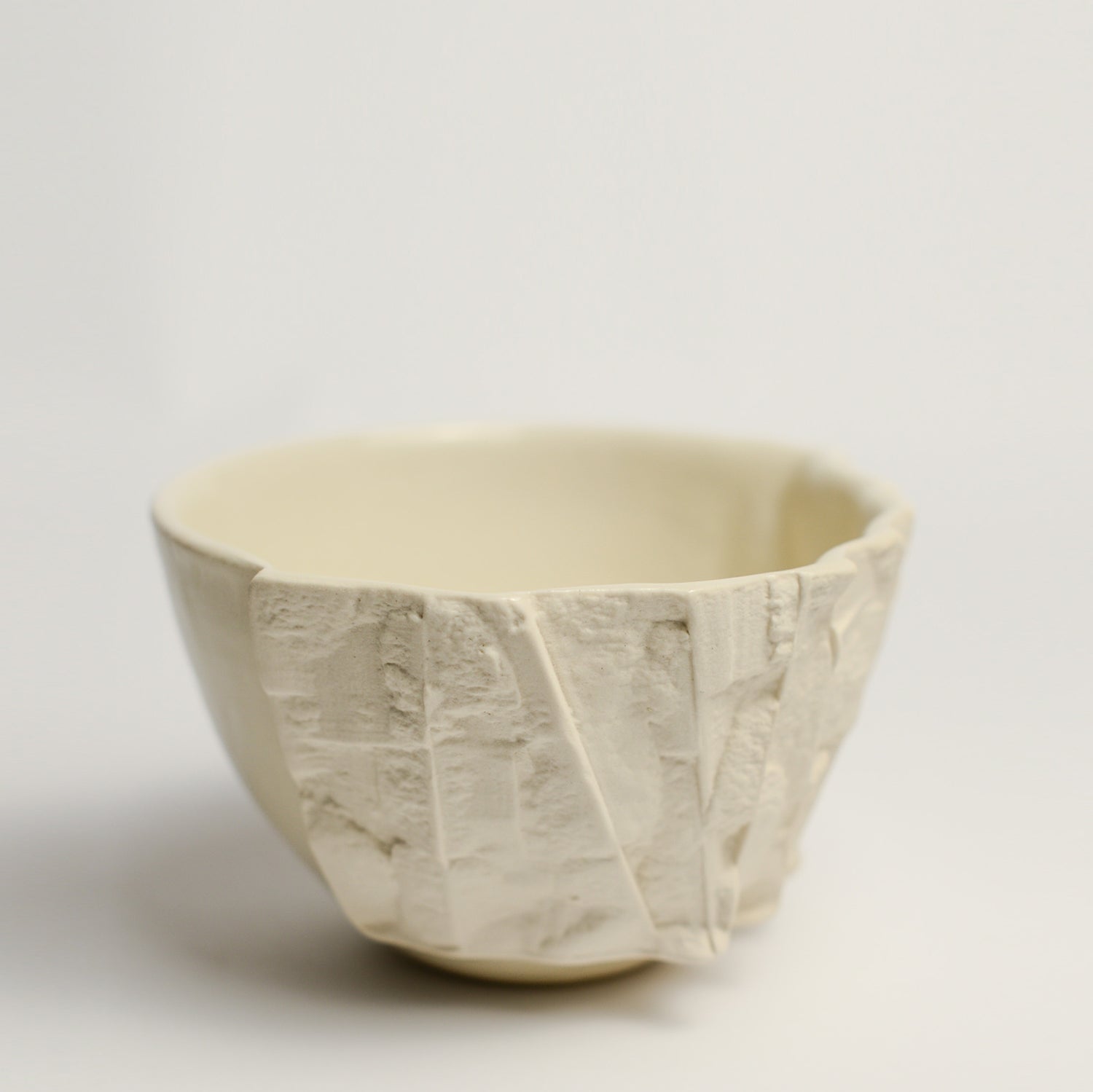 Small porcelain vase handmade by Perth-based ceramicist Annemieke Mulders. Inspired by elements found in nature, Annemieke predominantly works with slipcasting techniques to create contemporary ceramics with interesting forms and tactile surfaces using fine porcelain and stoneware clays. 