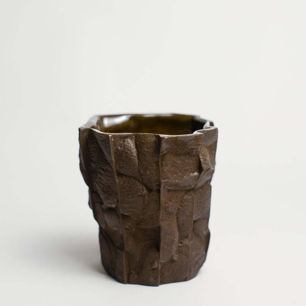 Small porcelain vase handmade by Perth-based ceramicist Annemieke Mulders. Inspired by elements found in nature, Annemieke predominantly works with slipcasting techniques to create contemporary ceramics with interesting forms and tactile surfaces using fine porcelain and stoneware clays.