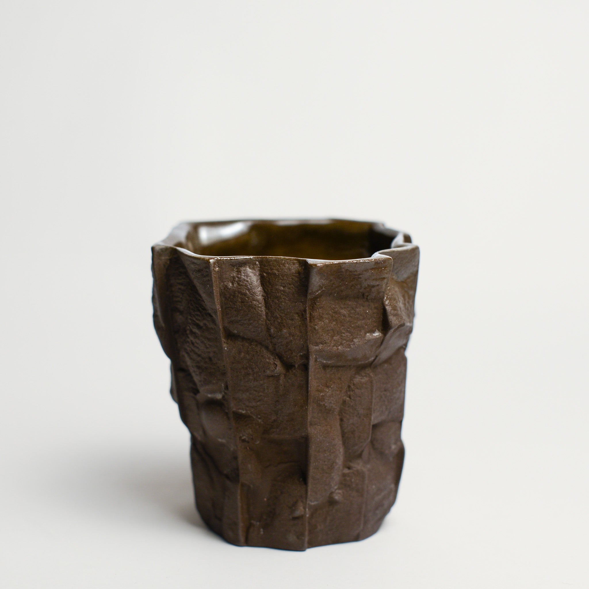 Small porcelain vase handmade by Perth-based ceramicist Annemieke Mulders. Inspired by elements found in nature, Annemieke predominantly works with slipcasting techniques to create contemporary ceramics with interesting forms and tactile surfaces using fine porcelain and stoneware clays.