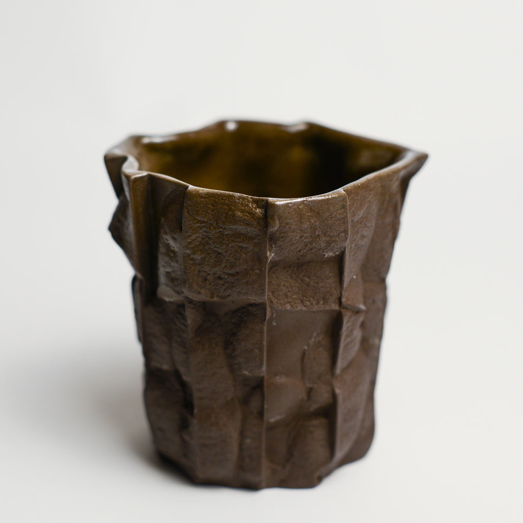 Small porcelain vase handmade by Perth-based ceramicist Annemieke Mulders. Inspired by elements found in nature, Annemieke predominantly works with slipcasting techniques to create contemporary ceramics with interesting forms and tactile surfaces using fine porcelain and stoneware clays.